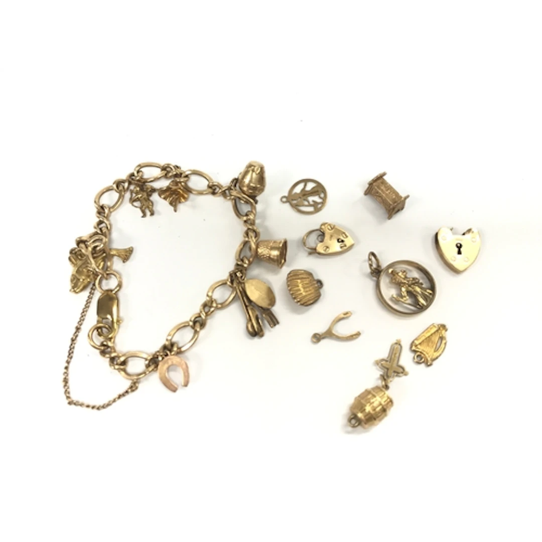 9ct charm bracelet with assorted other charms and pendants. ...