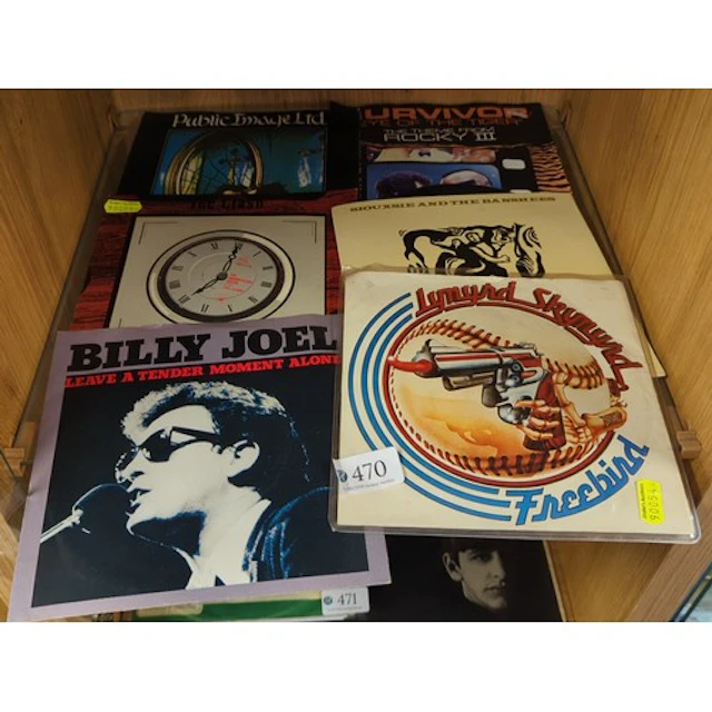 A mixed group of popular music 45s vinyl records and sleeves...