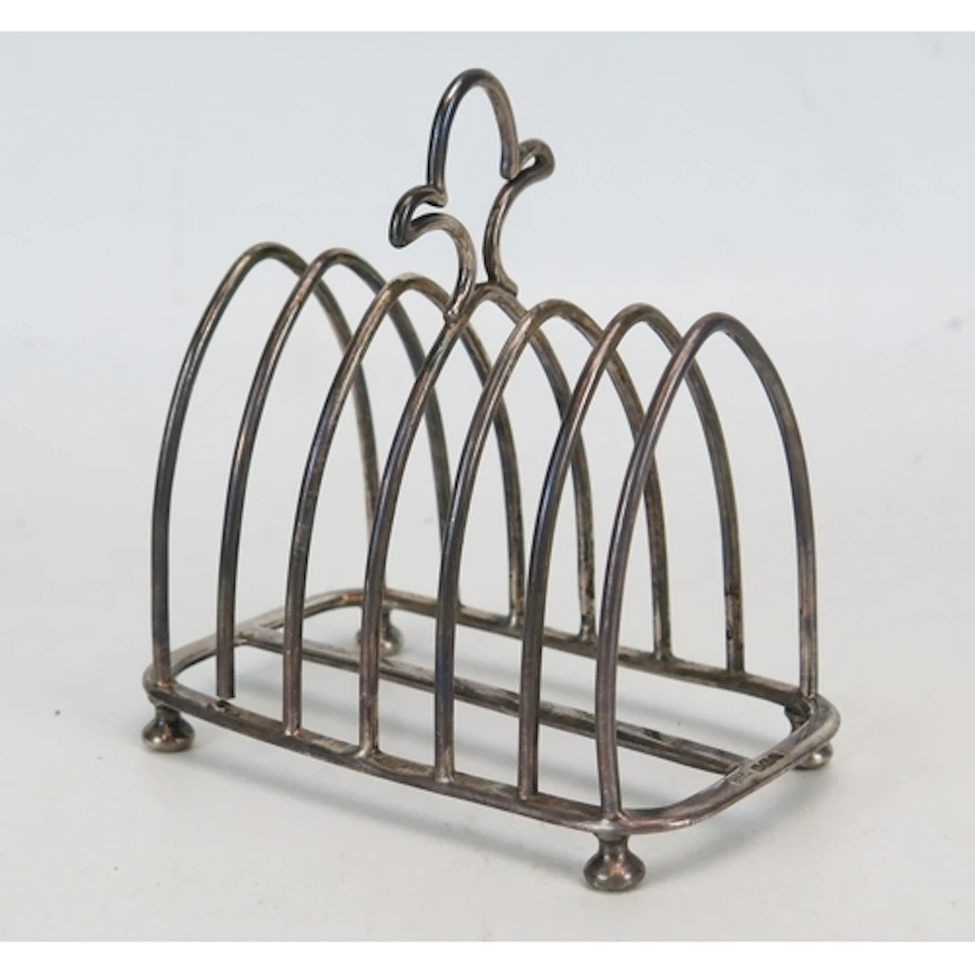 A Victorian silver toast rack, maker Walker & Hall, Sheffiel...