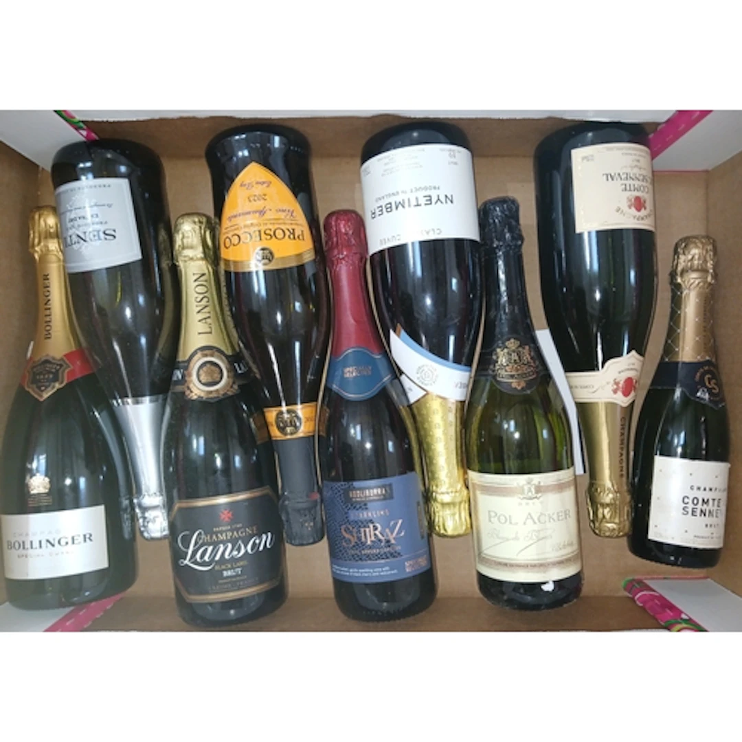 Nine bottles of assorted sparkling wine.