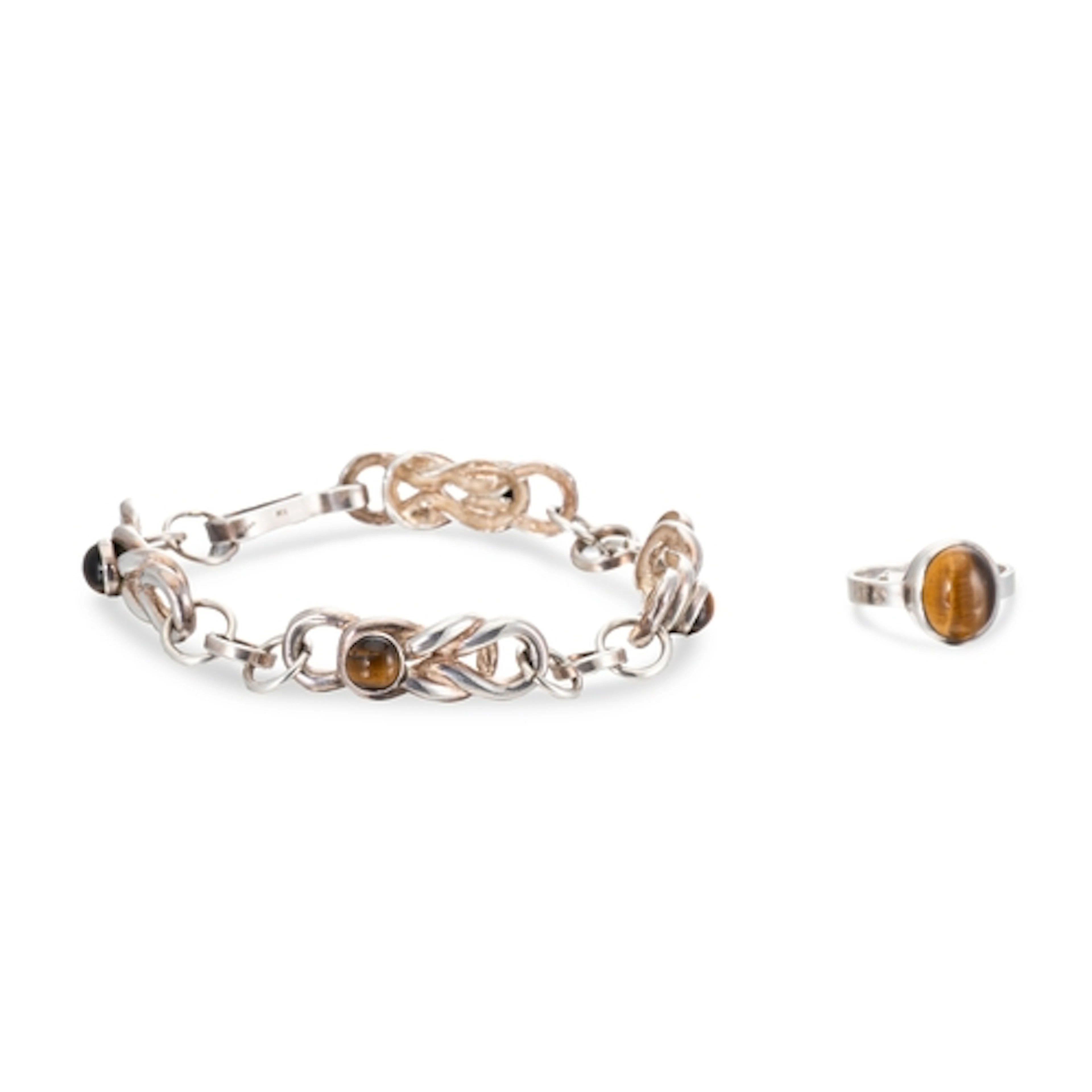 A TIGER'S EYE RING, in silver, by Liam Costigan, together wi...