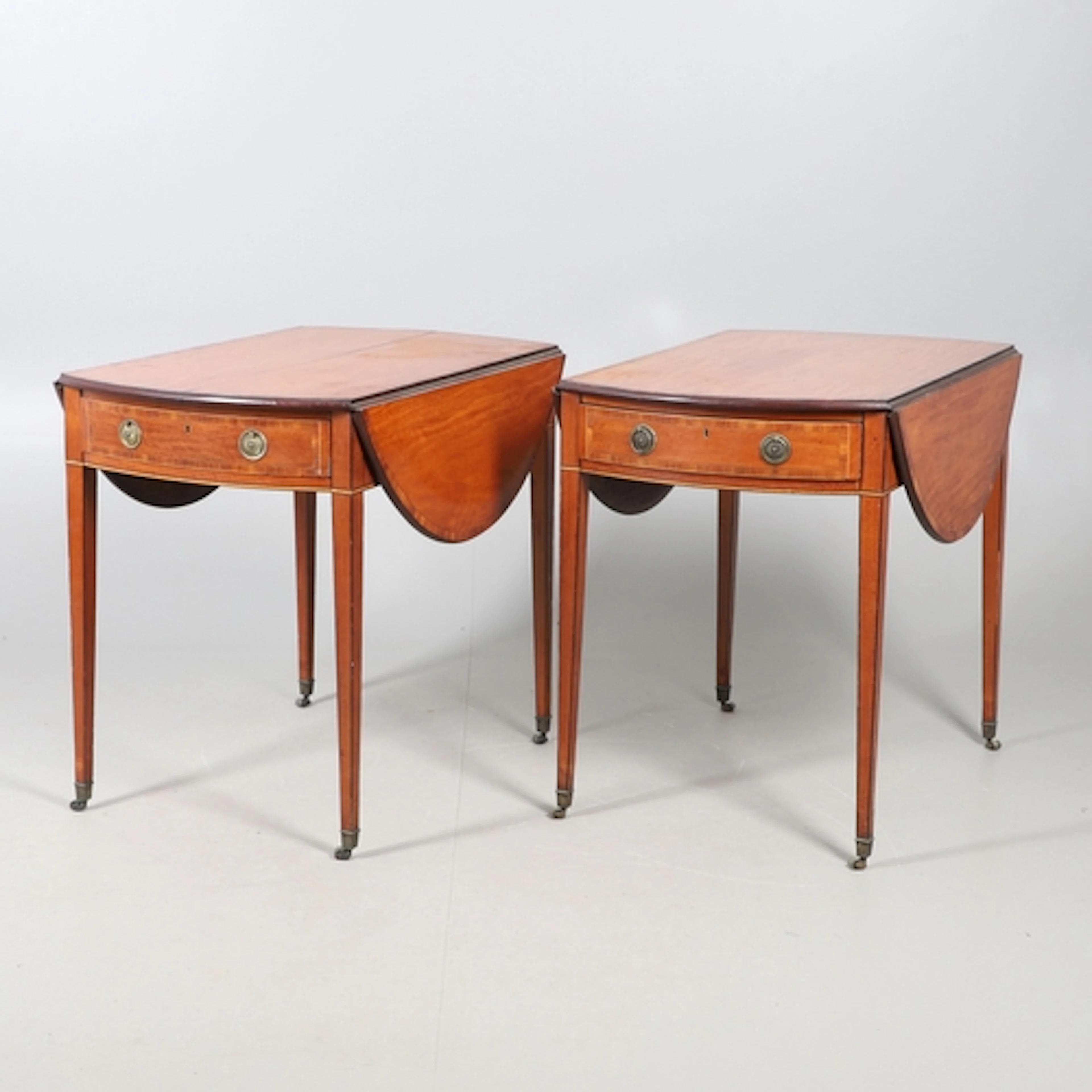A PAIR OF EDWARDIAN SATINWOOD AND CROSSBANDED PEMBROKE TABLE...