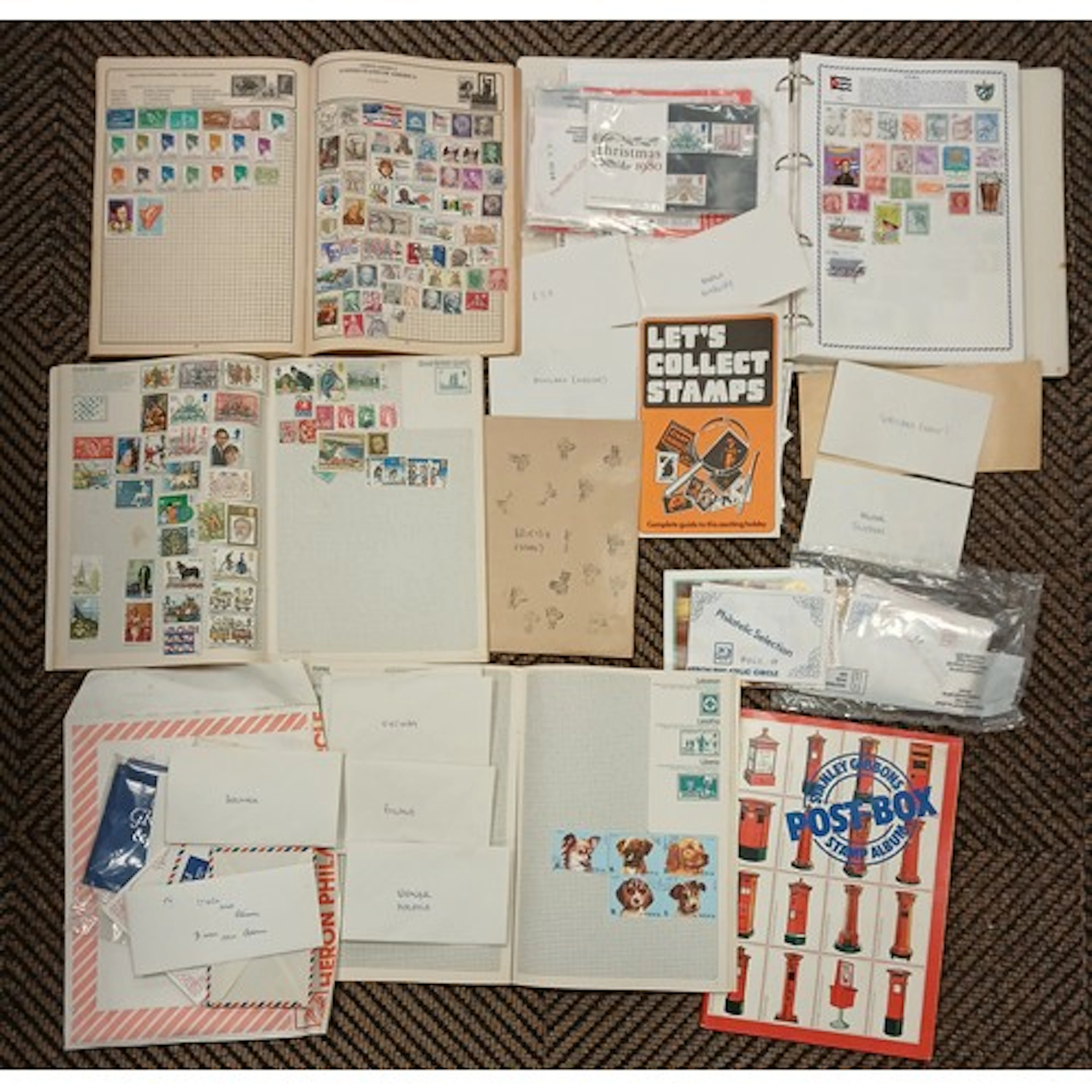 Collection of three loosely-filled stamp albums with loose i...