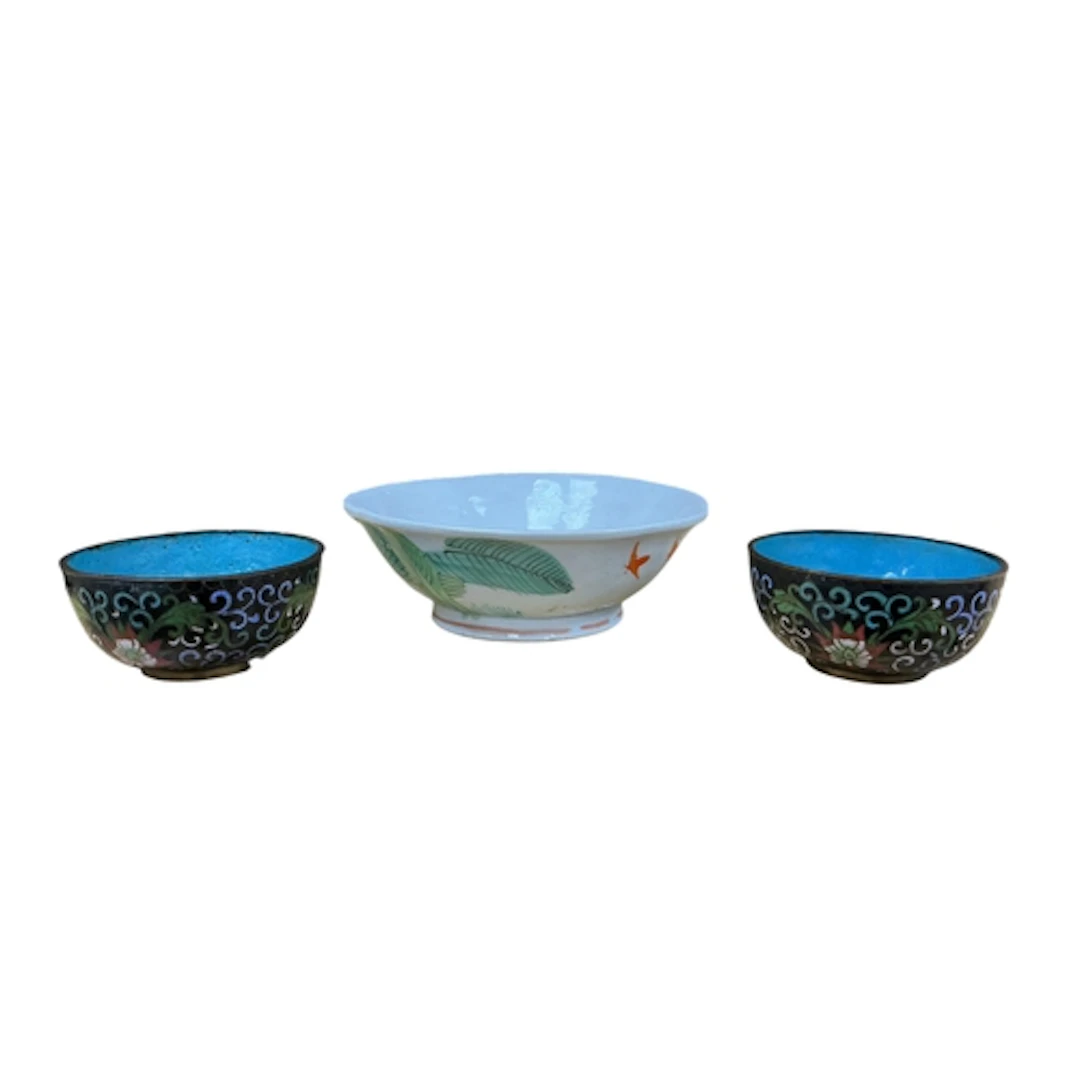 A Chinese bowl decorated with a cockerel and two small clois...