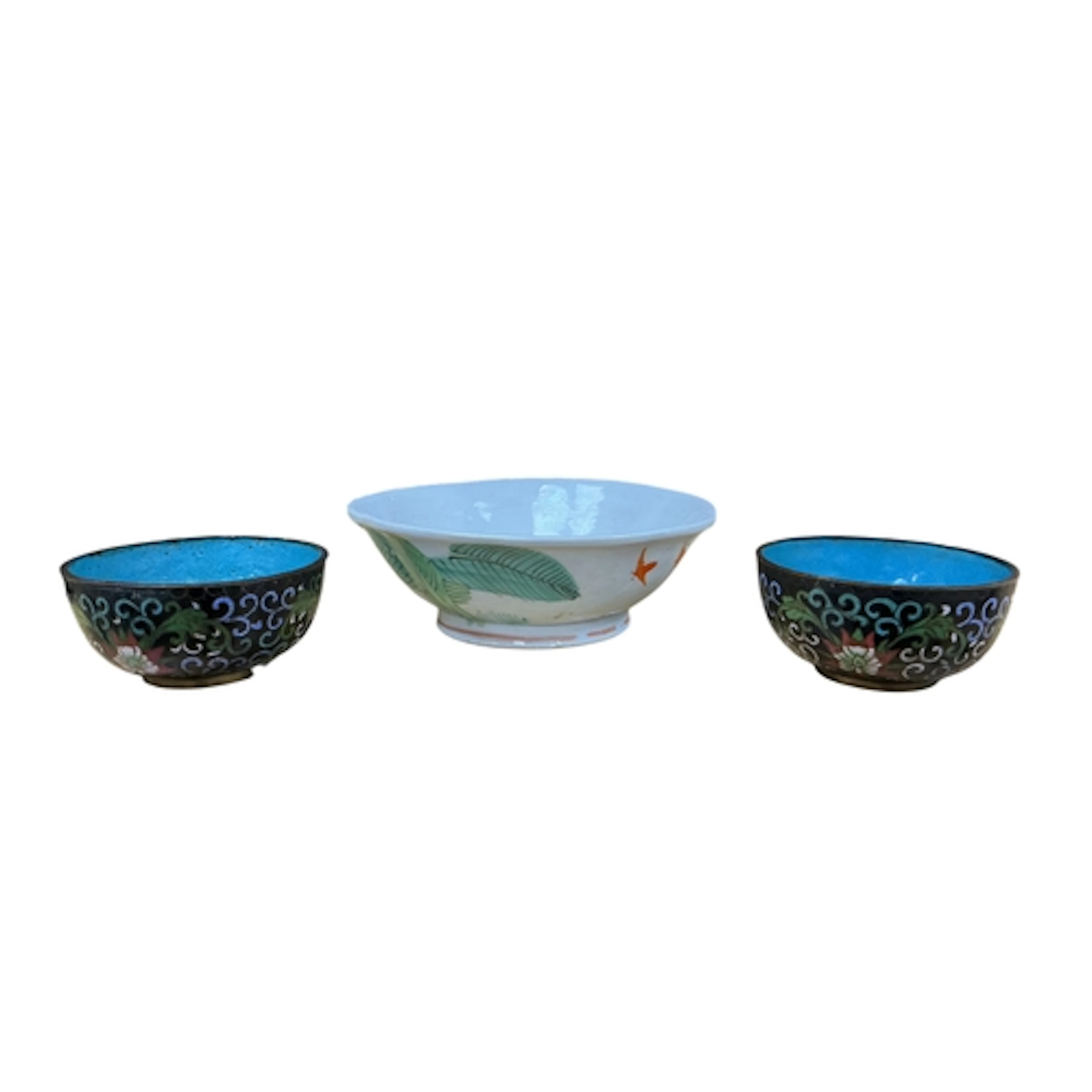 A Chinese bowl decorated with a cockerel and two small clois...