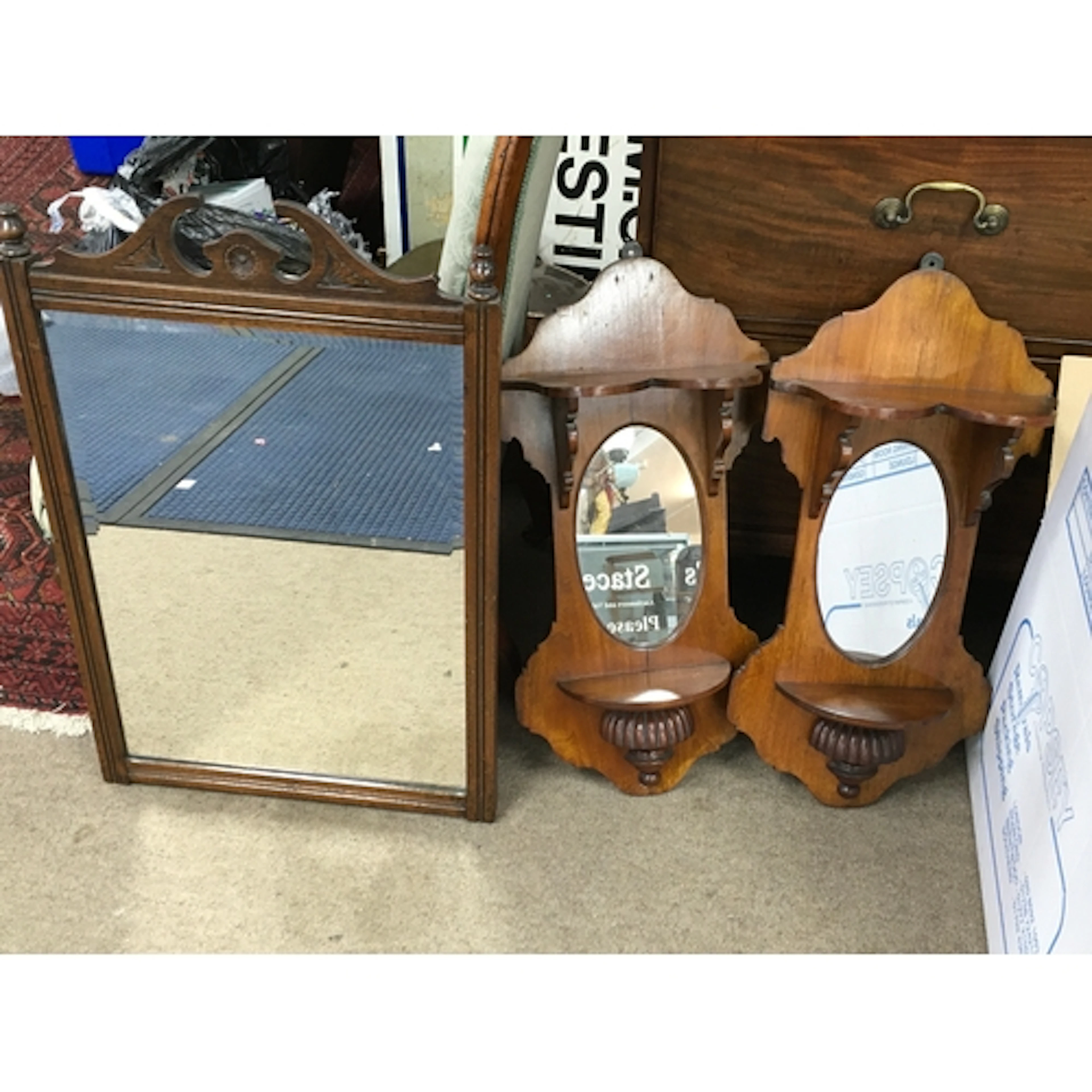 pair of vintage wooden wall-mounted mirror sconces and a wal...