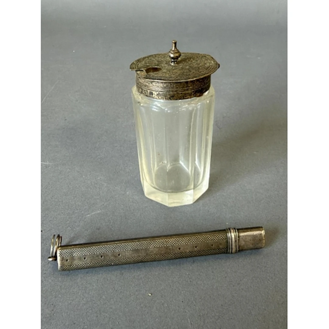 A hallmarked silver topped glass cruet and a hallmarked silv...