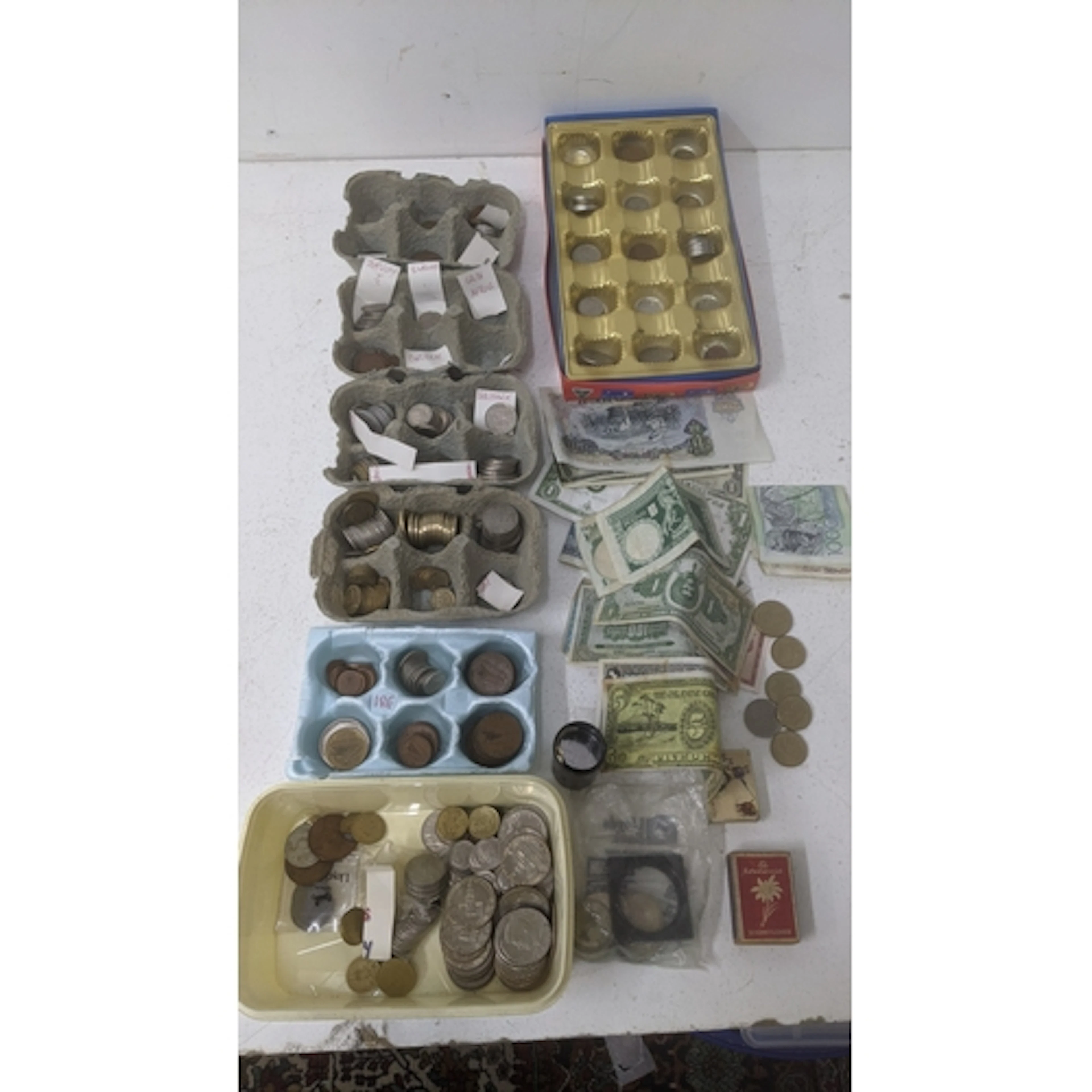 Coins from around the world to include examples from New Zea...