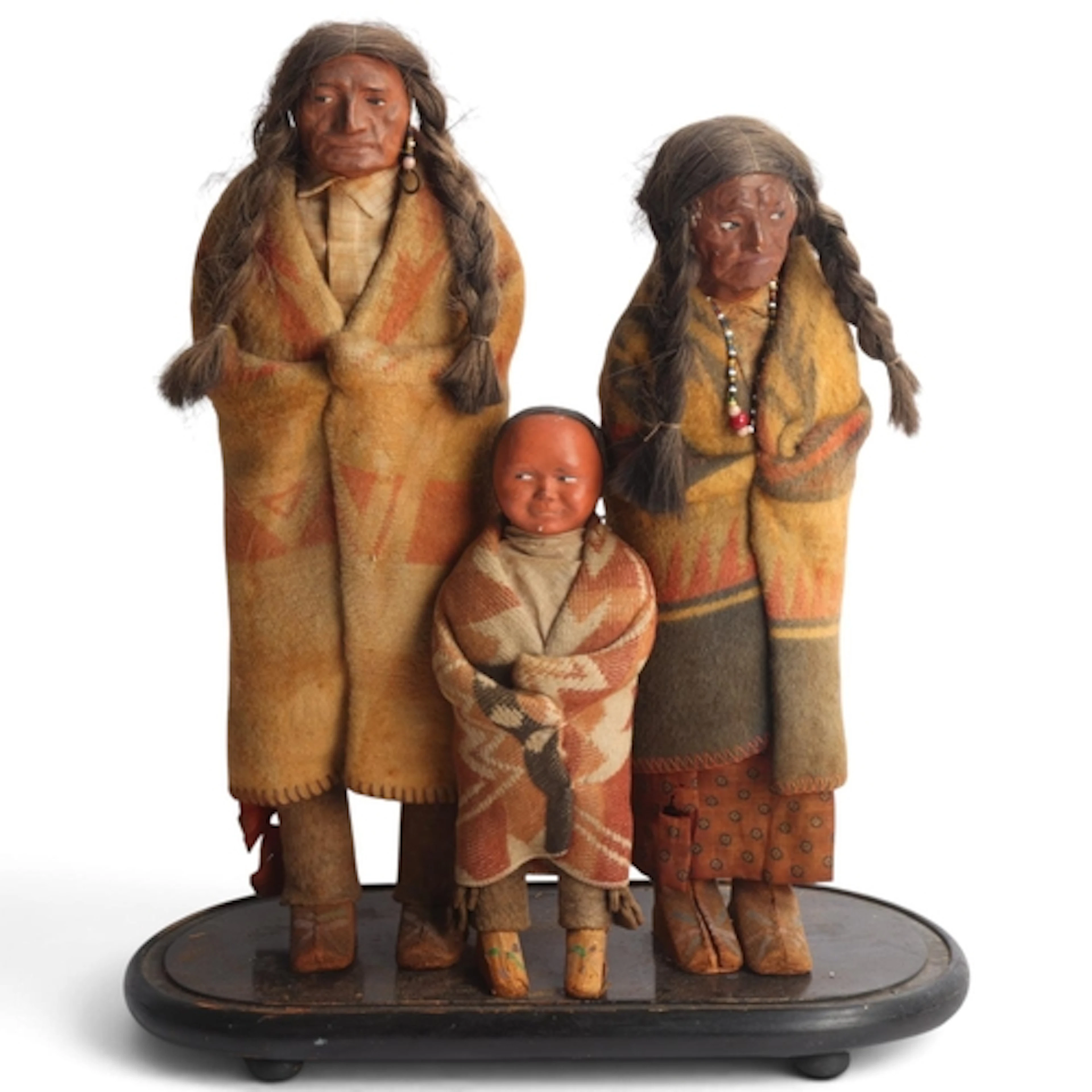 A group of 3 Native American Skookum family dolls, early 20t...