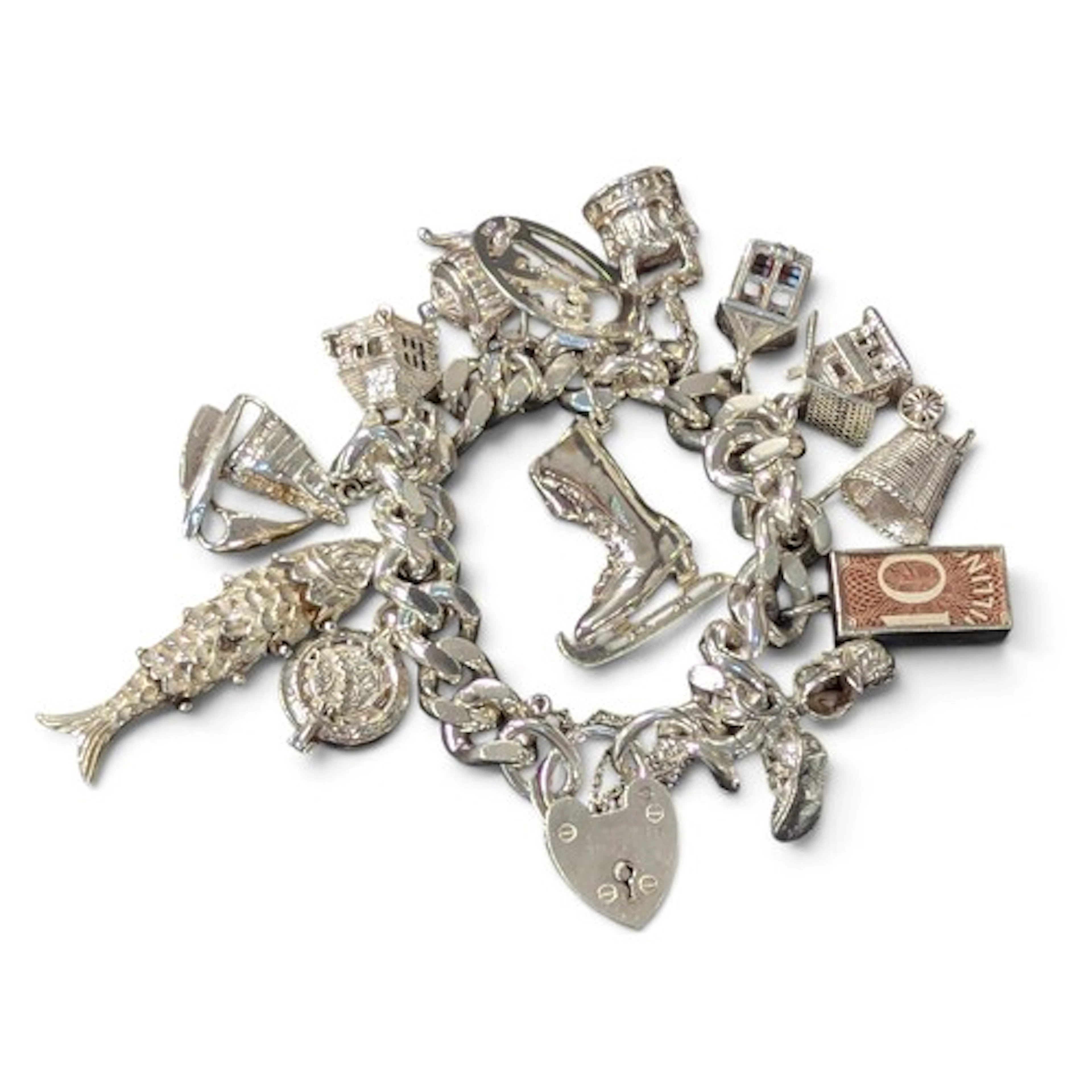 A silver charm bracelet, holding many charms including an ar...