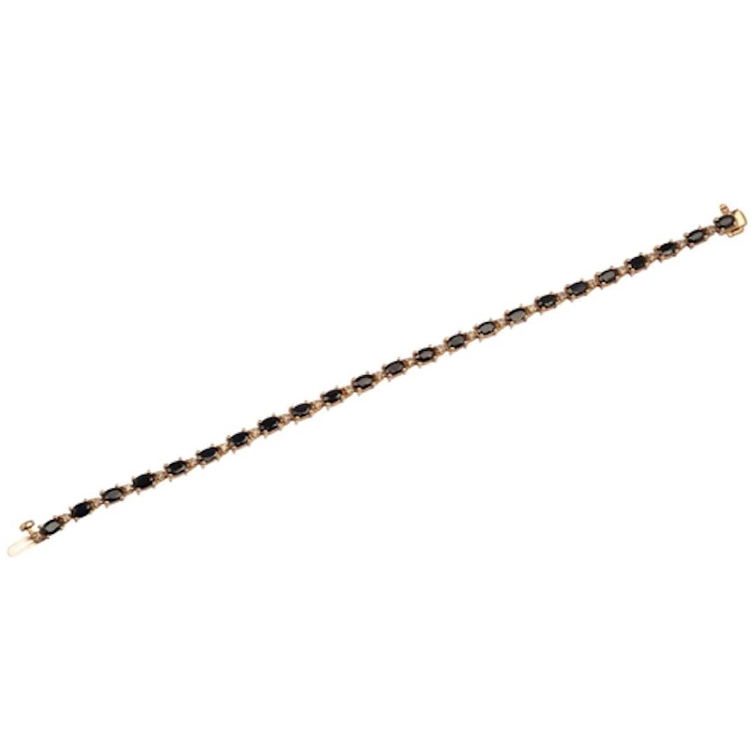 A sapphire and diamond line bracelet, composed of links set ...