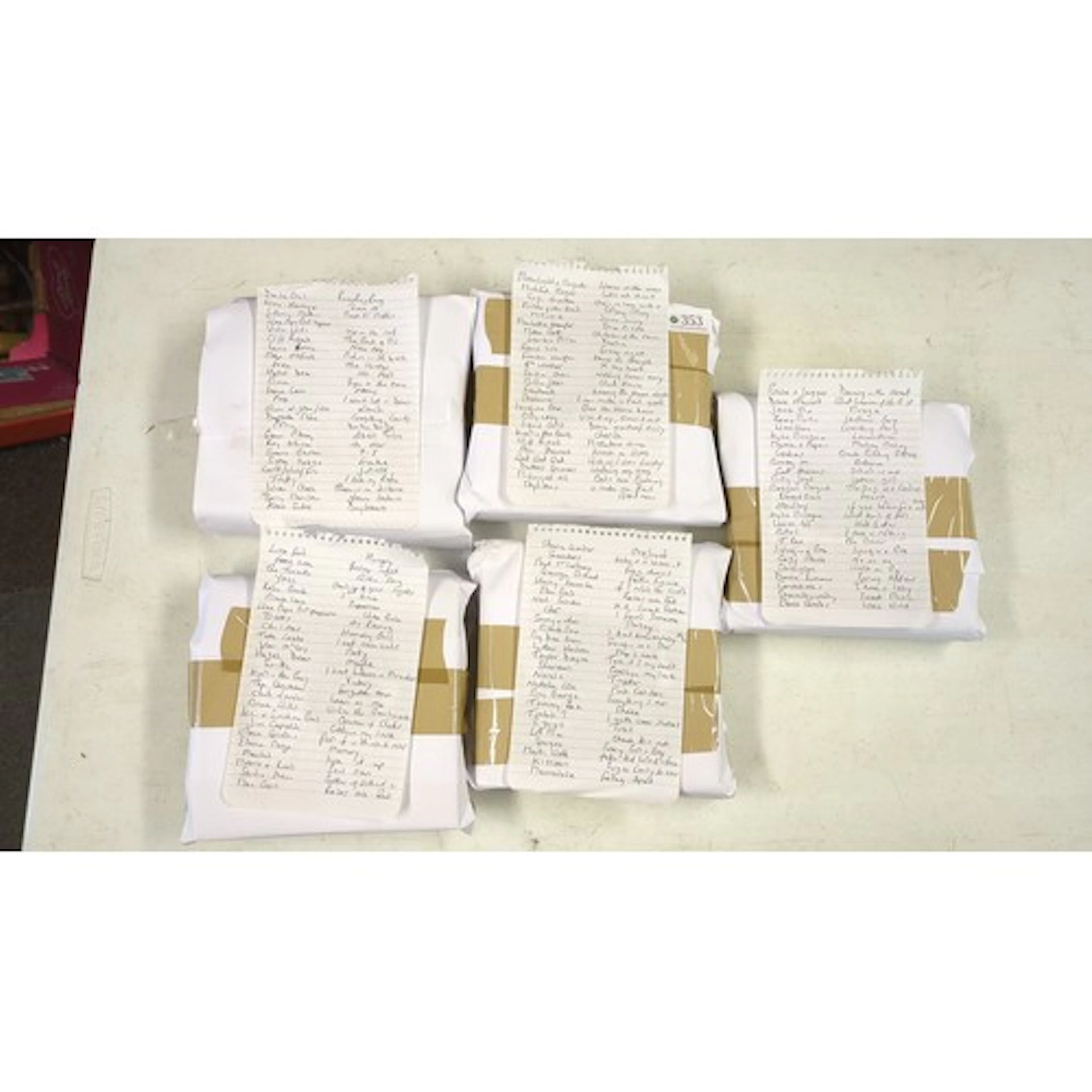 A group 45s with handwritten lyric and artist-title lists; f...