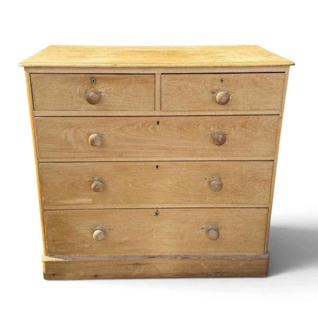 A VICTORIAN WAXED PINE CHEST OF TWO SHORT AND THREE LONG DRA...