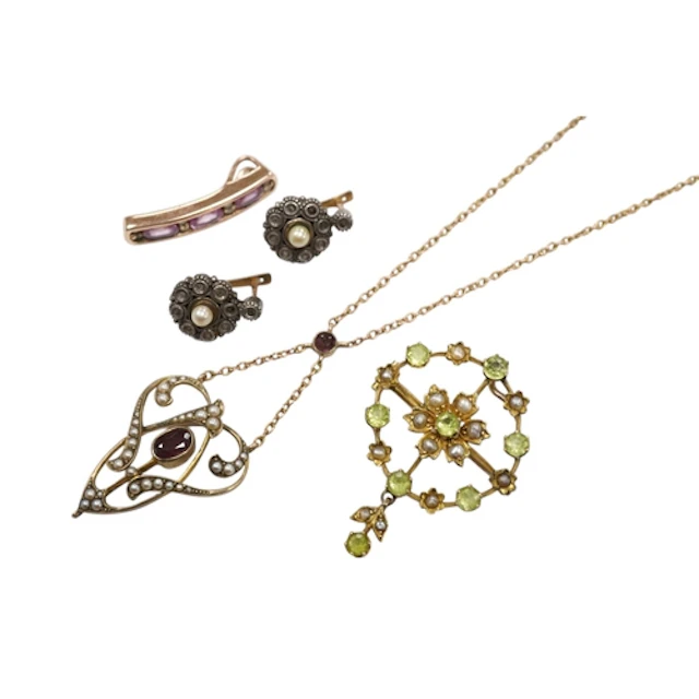Two early 20th century yellow metal and gem set pendants, on...