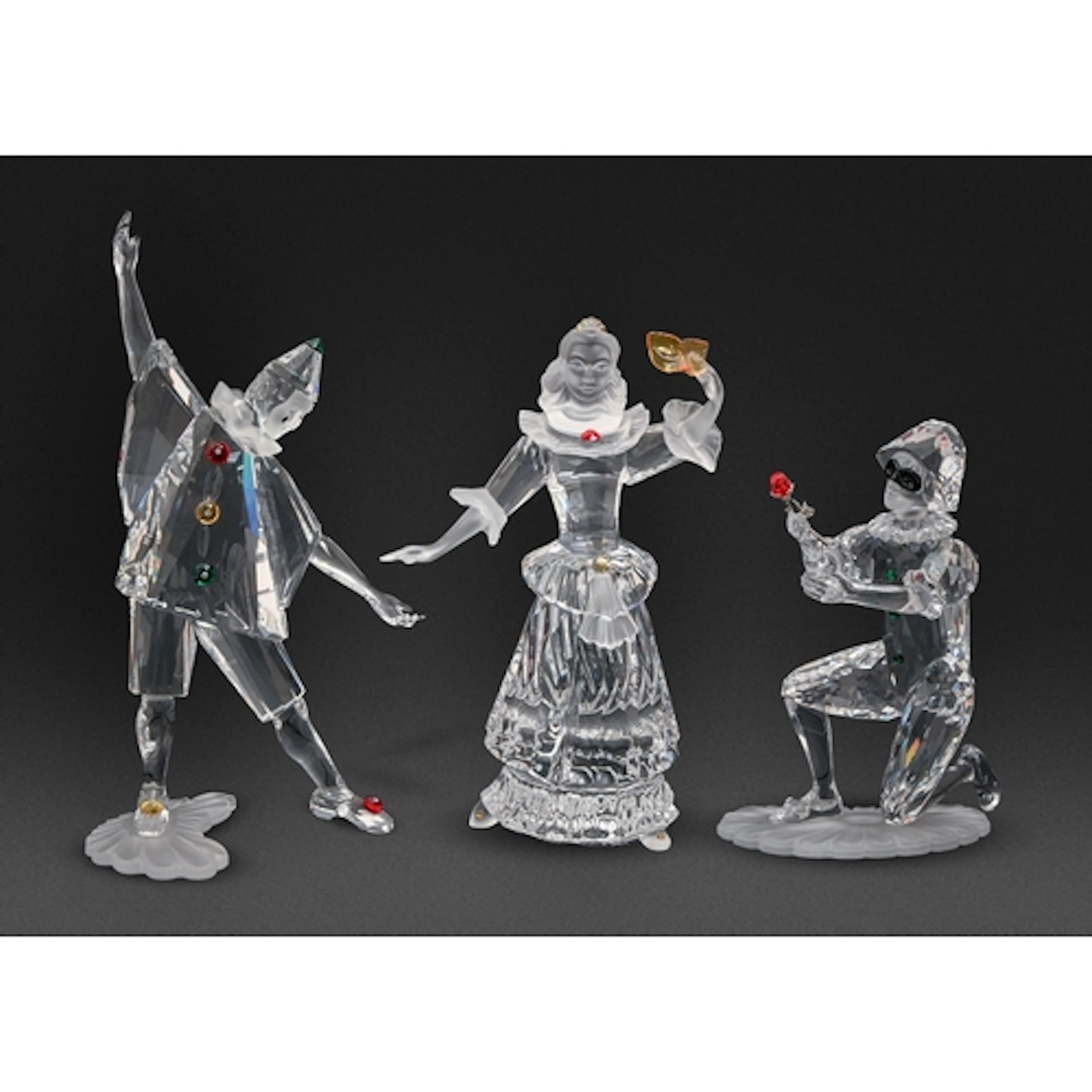 Three Swarovski 'Masquerade' figures, c2000, Pierrot, Harleq...