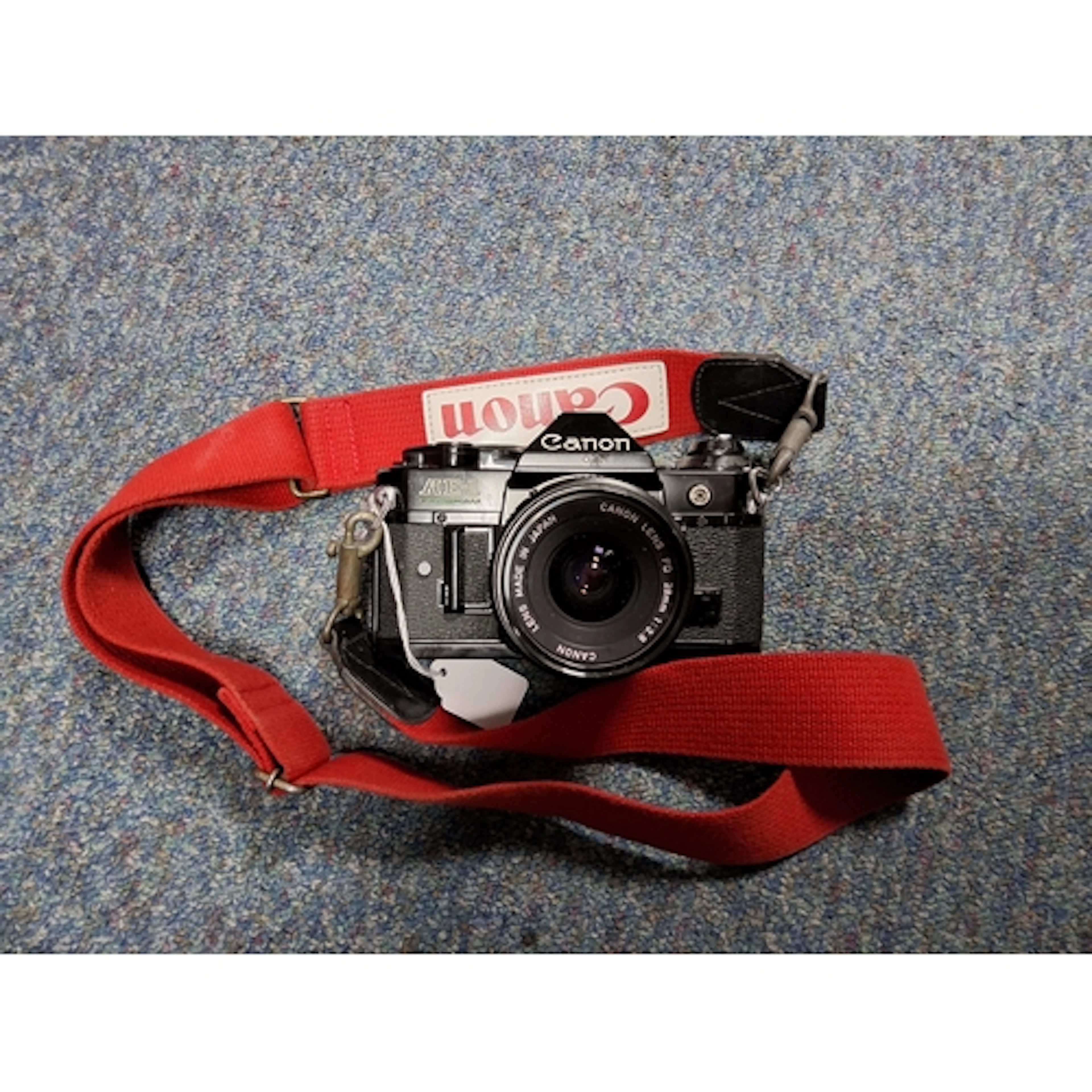 A CANON AE-1 CAMERA fitted with a FD 28mm 1:2.8 Canon lens, ...