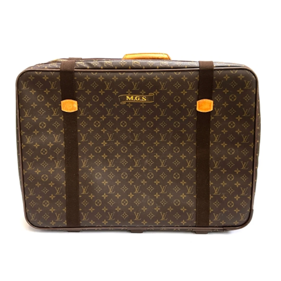 A Louis Vuitton monogrammed suitcase with webbing straps, 72...