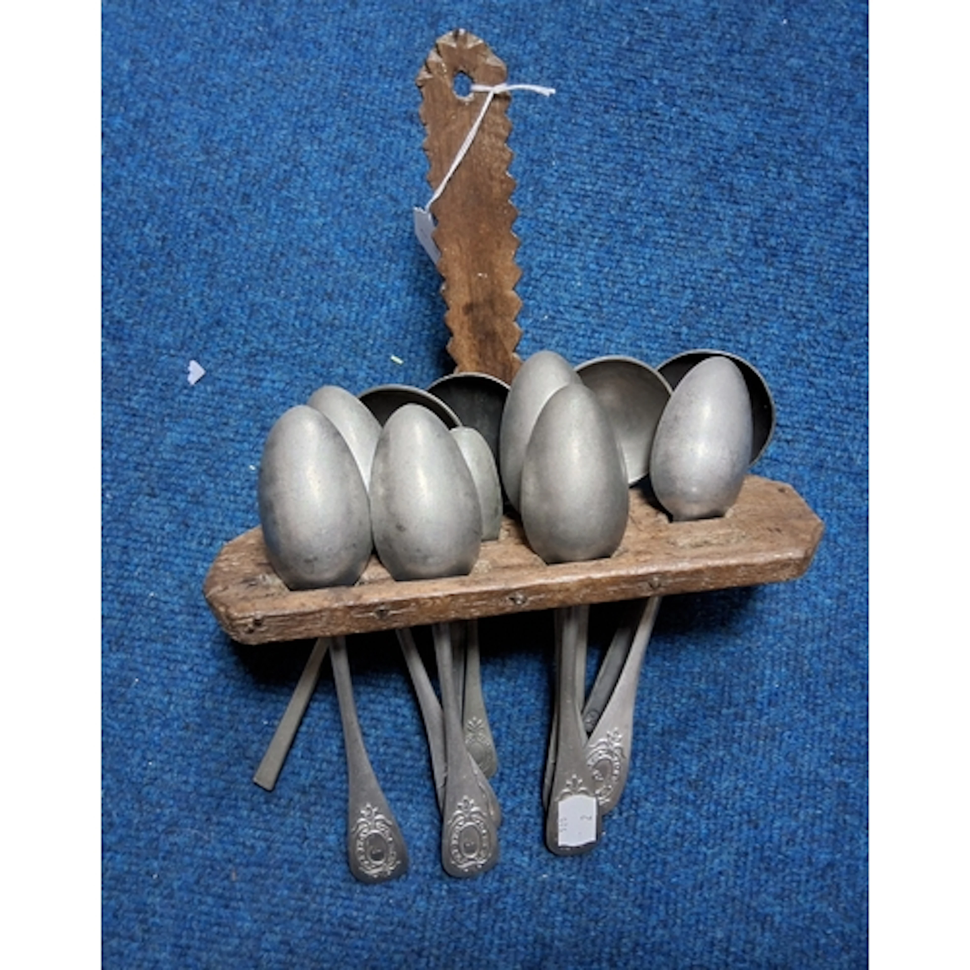 PRIMITIVE SPOON RACK WITH PEWTER SPOONS to include two spoon...
