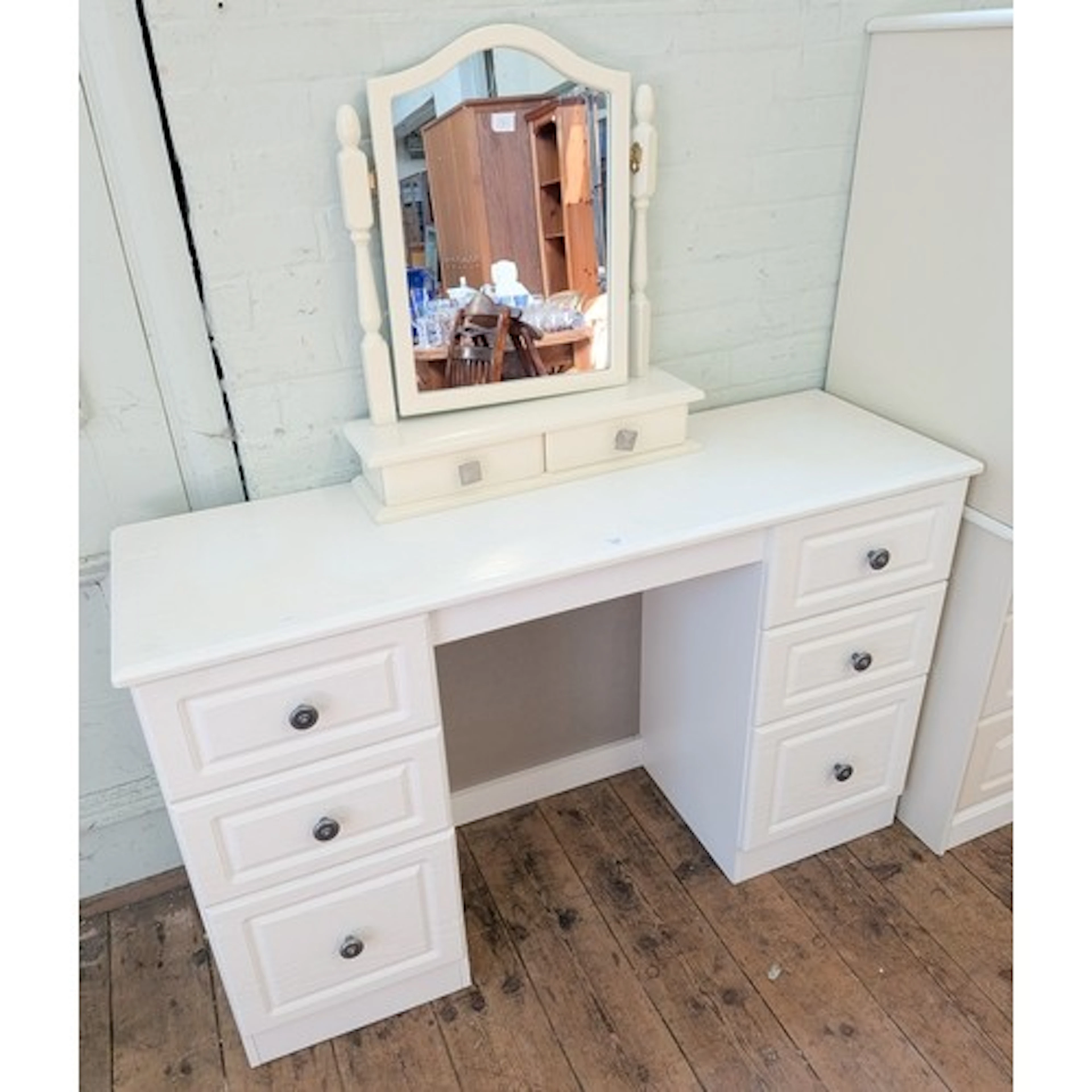 A modern white knee-hole dressing table together with two th...