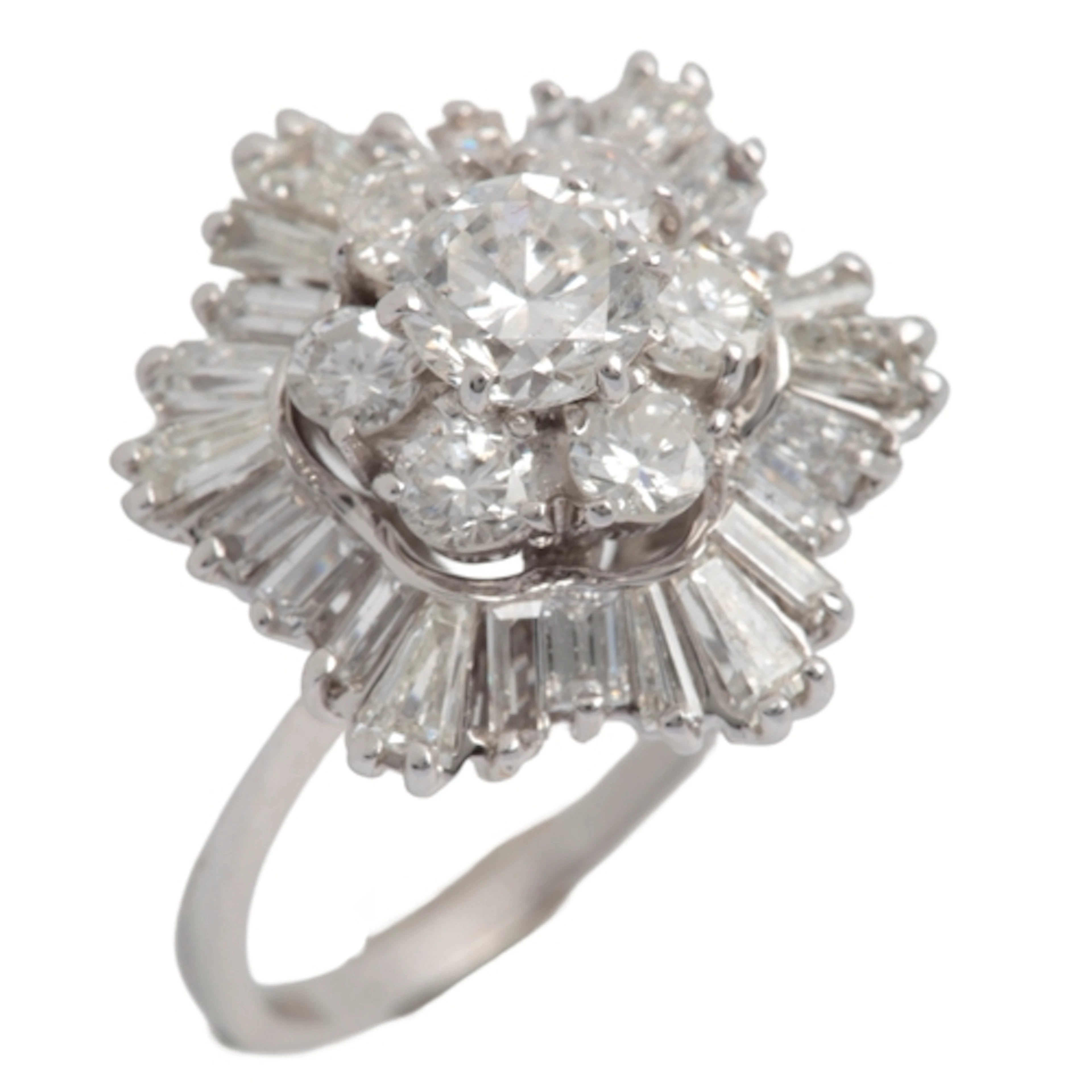 A diamond cluster ring, 1960s, centring on a cluster of circ...