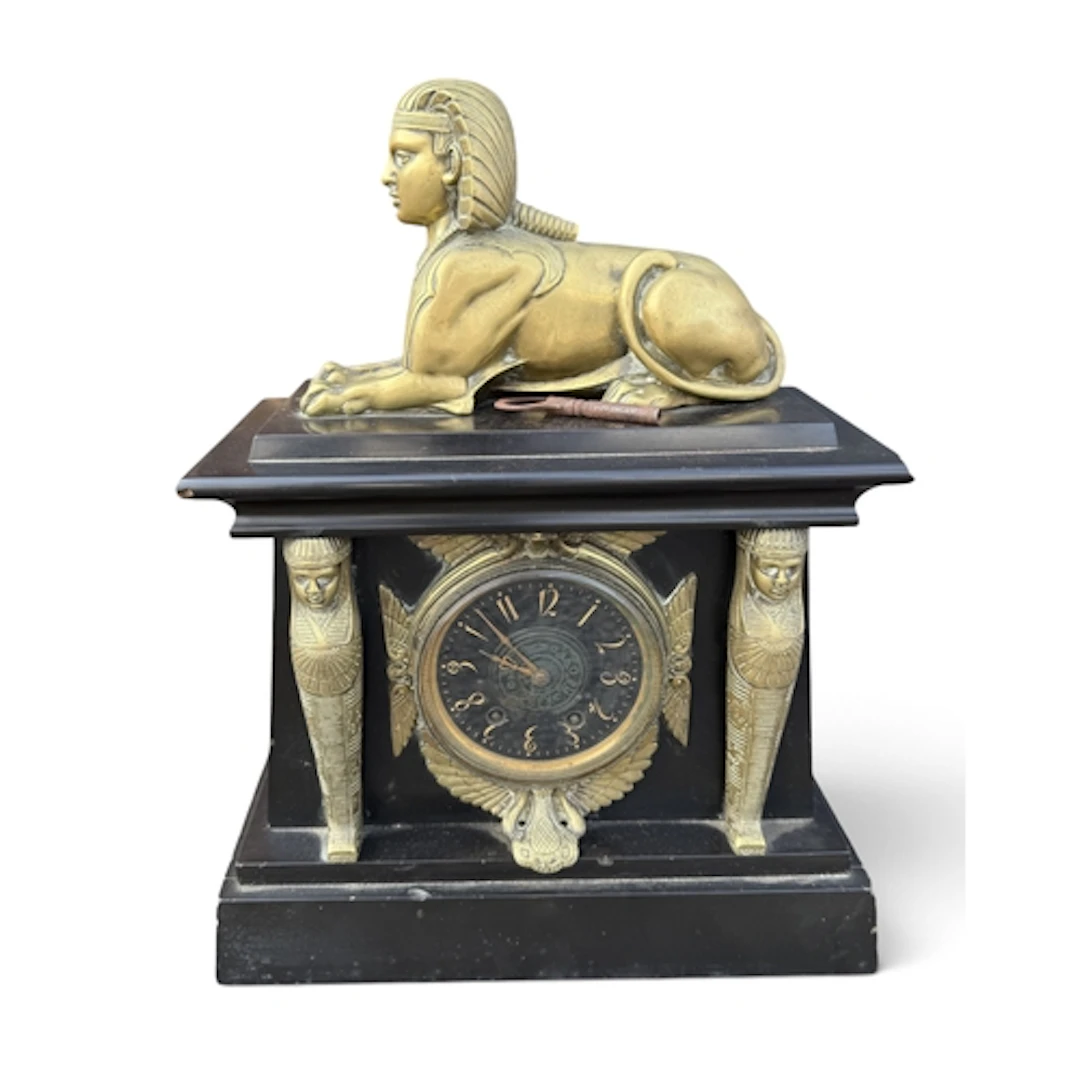AN EGYPTIAN REVIVAL MANTLE CLOCK SURMOUNTED BY BRASS SPHYNX ...