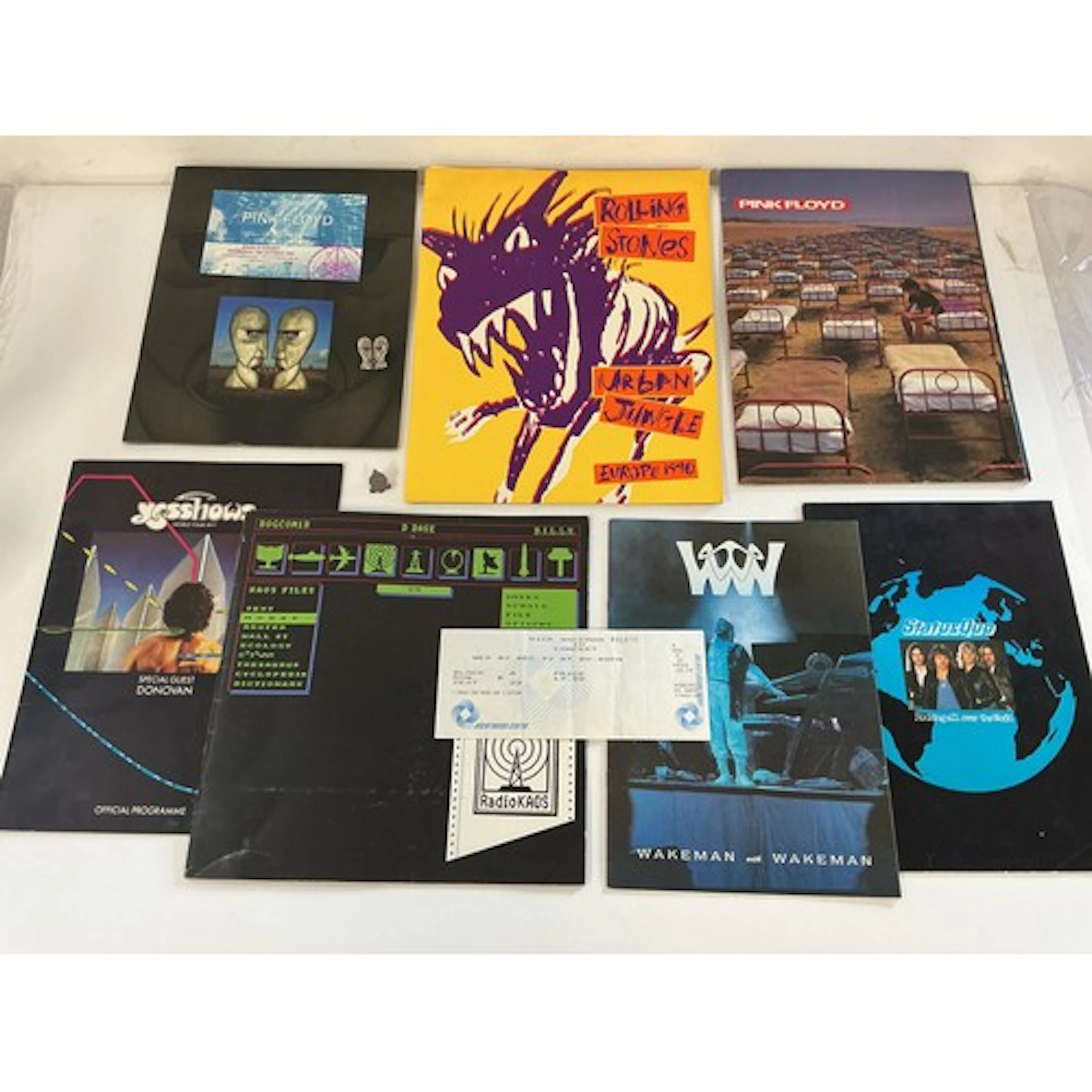 A collection of music programs, some with tickets for variou...