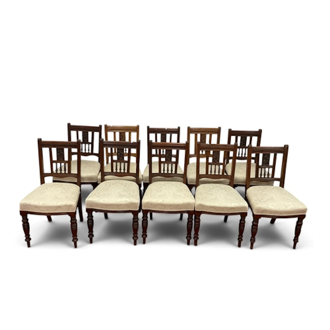 A Set of Eight Early XX Century Walnut Dining Chairs, each w...