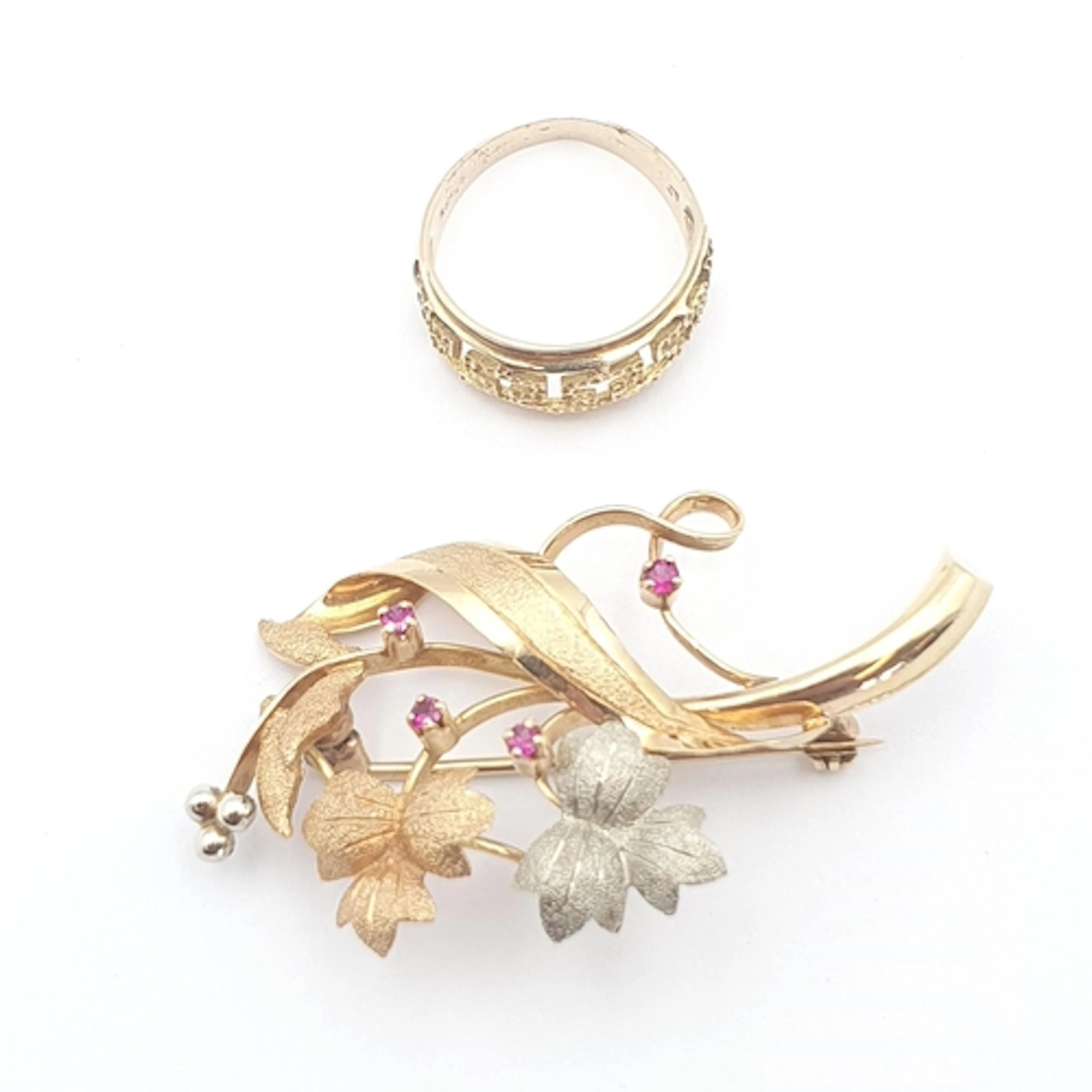 A three colour gold Brooch of foliate design set small rubie...