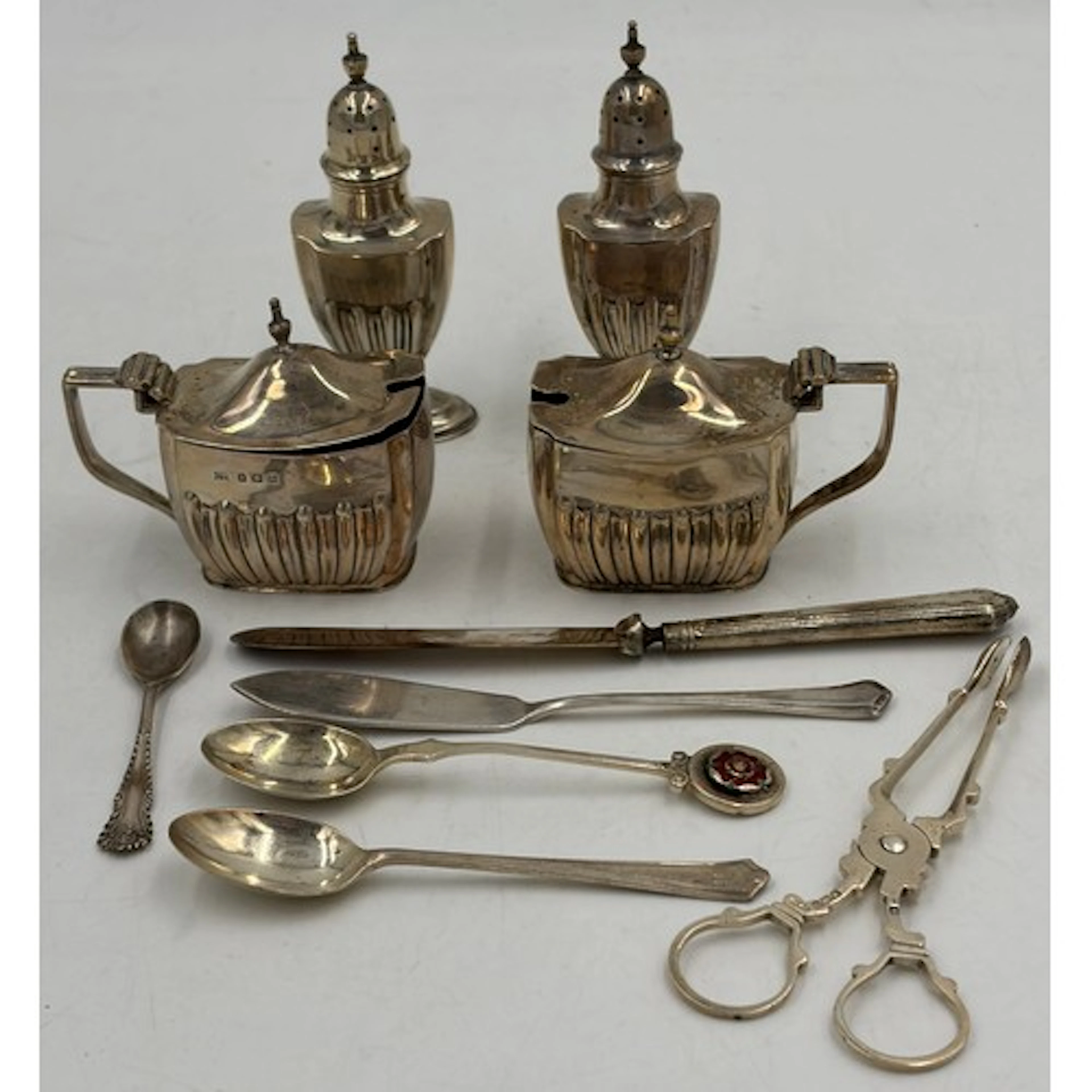 A collection of hallmarked silver to include 2 x pepper pots...