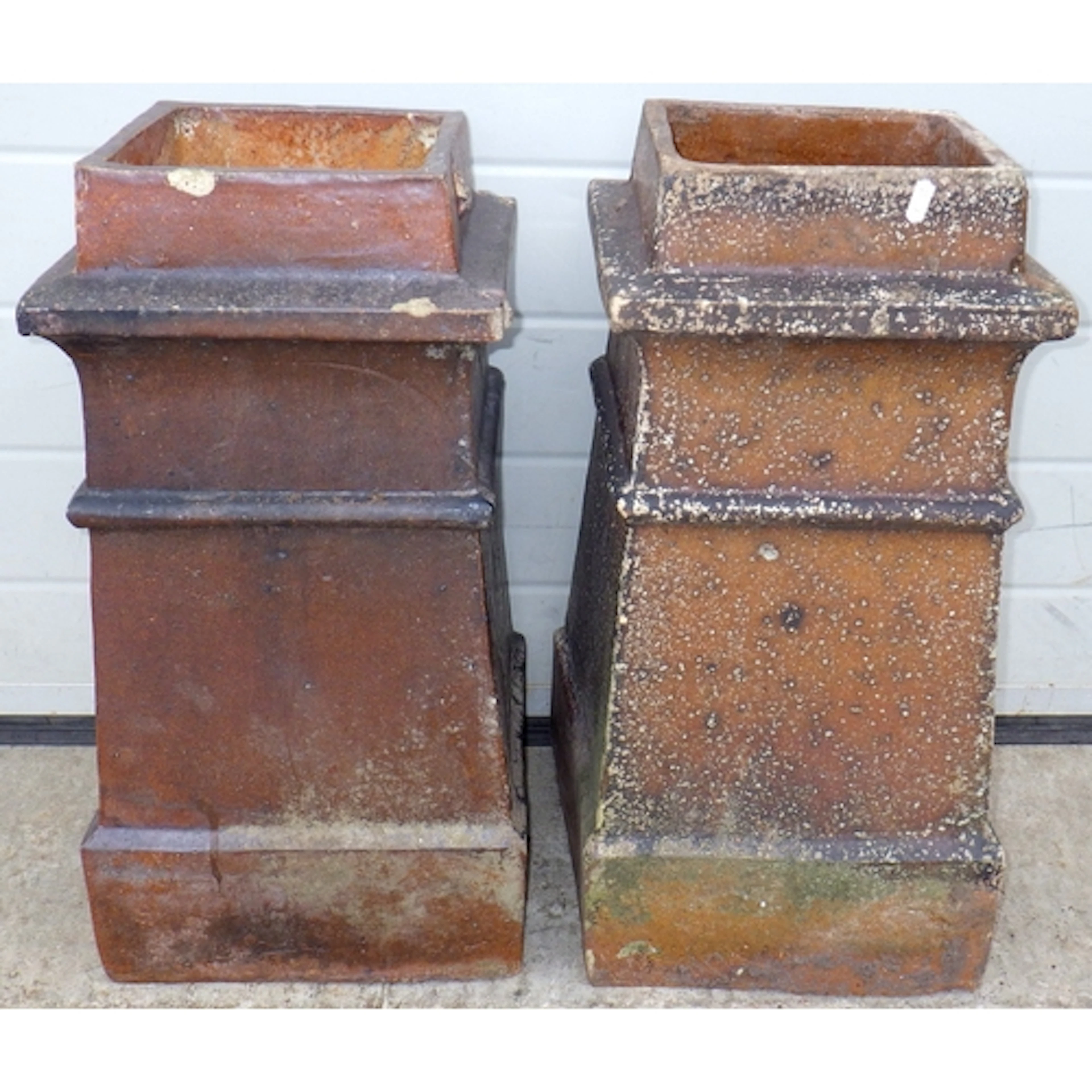 Two square chimney pots, chips, tallest 60cm tall