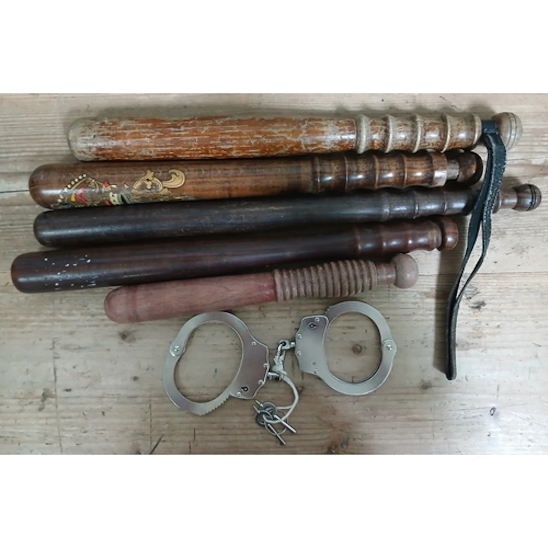 A group of four truncheons and a pair of cufflinks.
