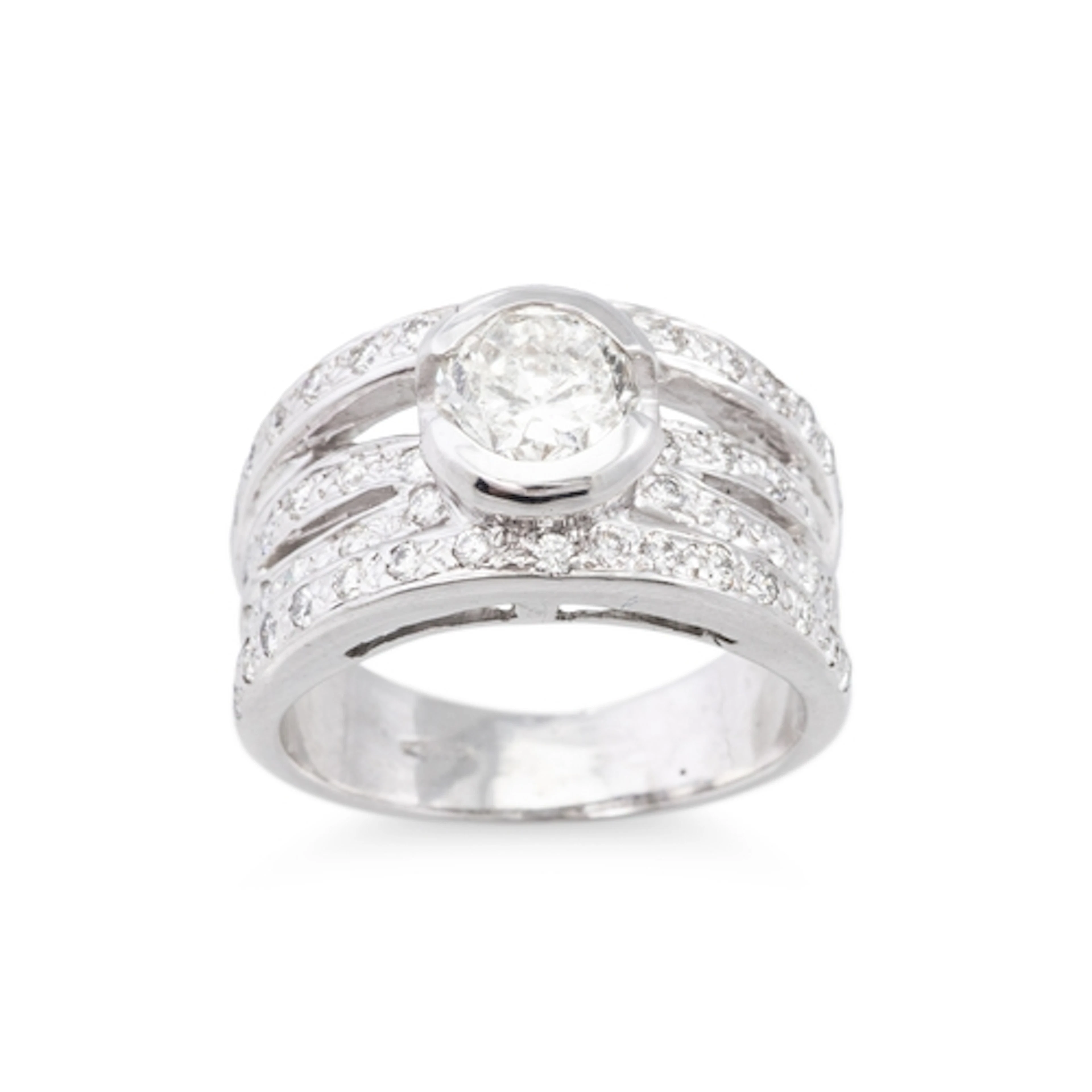 A DIAMOND RING, the central bezel set brilliant cut diamond ...