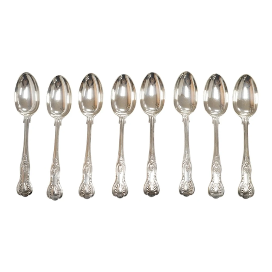A set of eight Victorian silver Kings pattern dessert spoons...