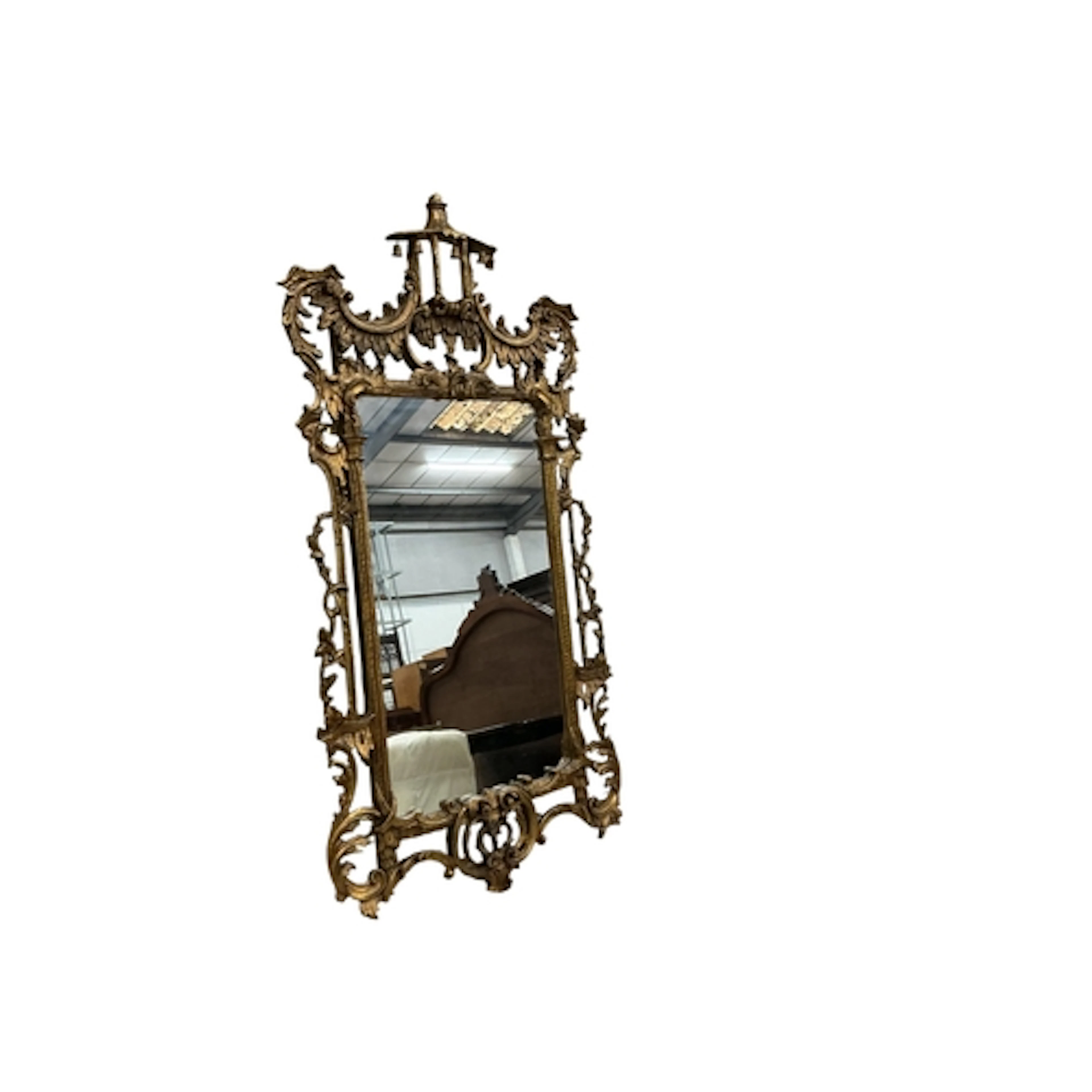 An ornate, carved gilt and gesso wall mirror in the Chinese ...