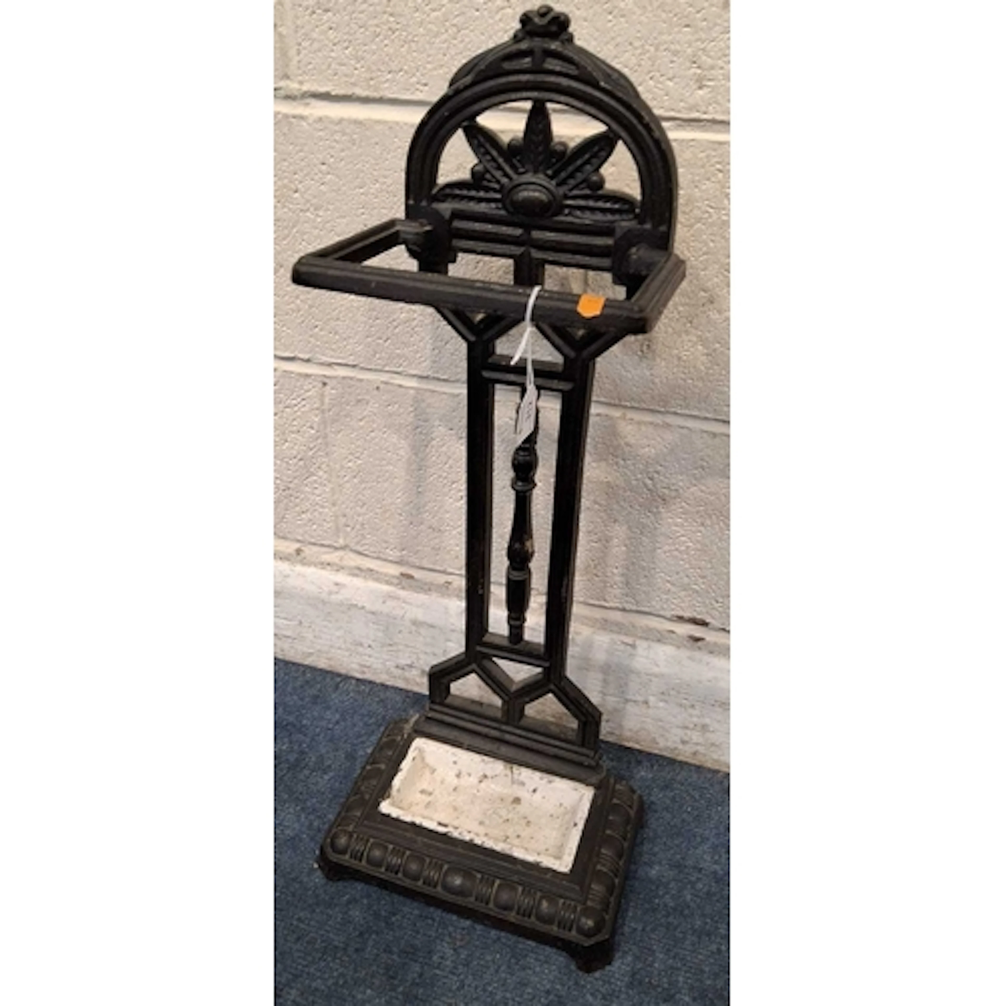 A CAST IRON STICK STAND, with a single section, geometric sh...