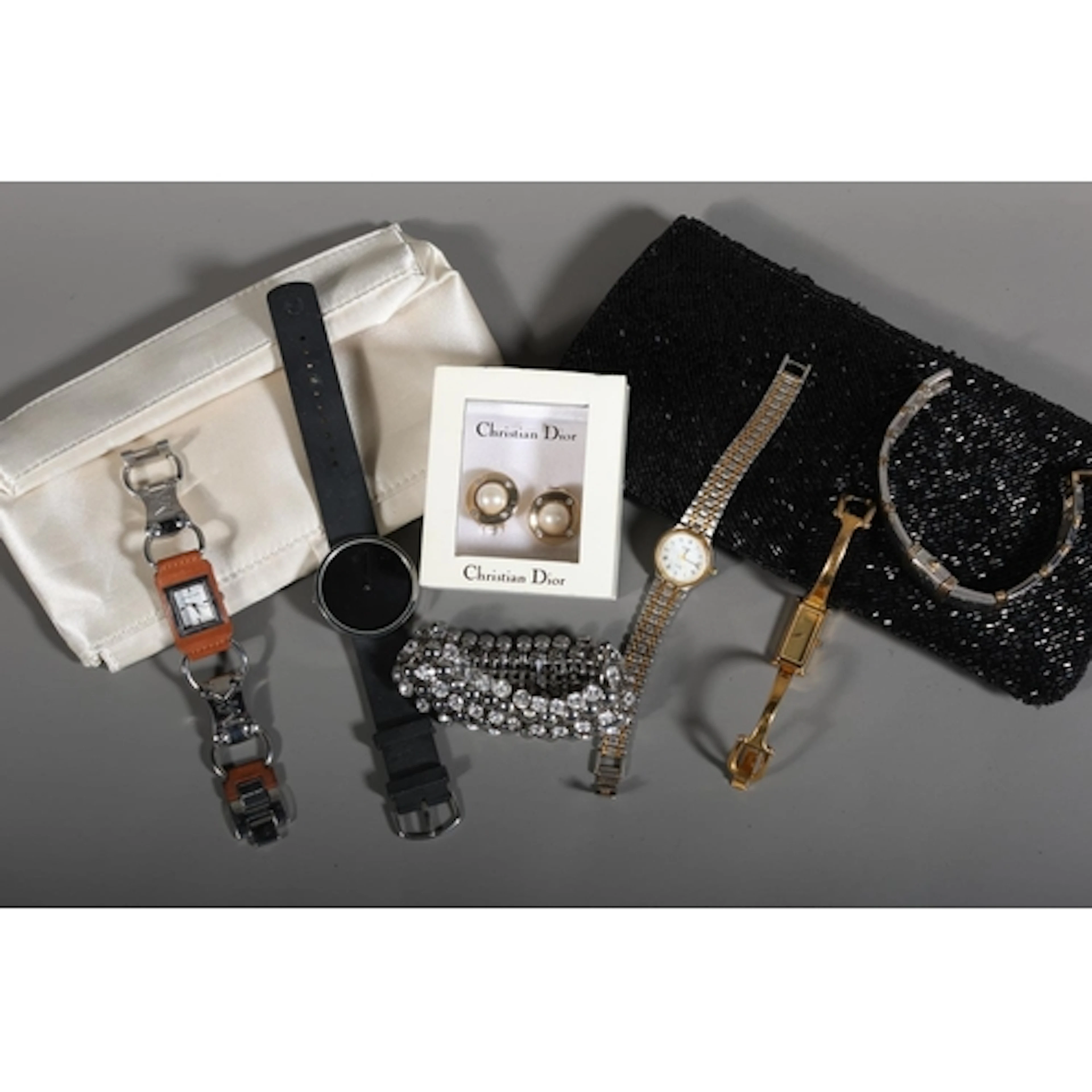 Pair of earring held in Christian Dior box, Michael Kors wri...