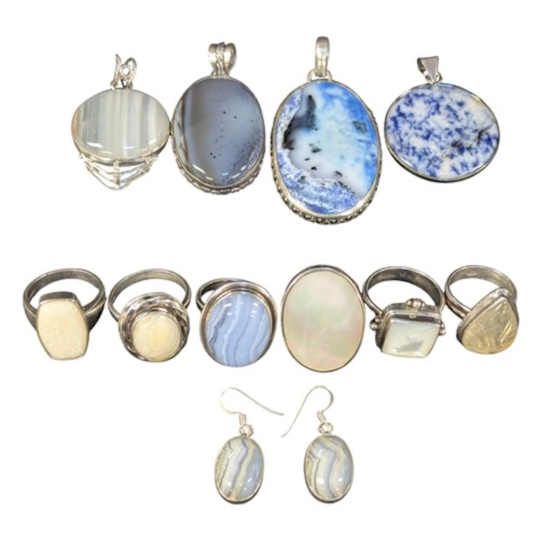 A reticulated quartz silver mounted pear drop ring, others a...