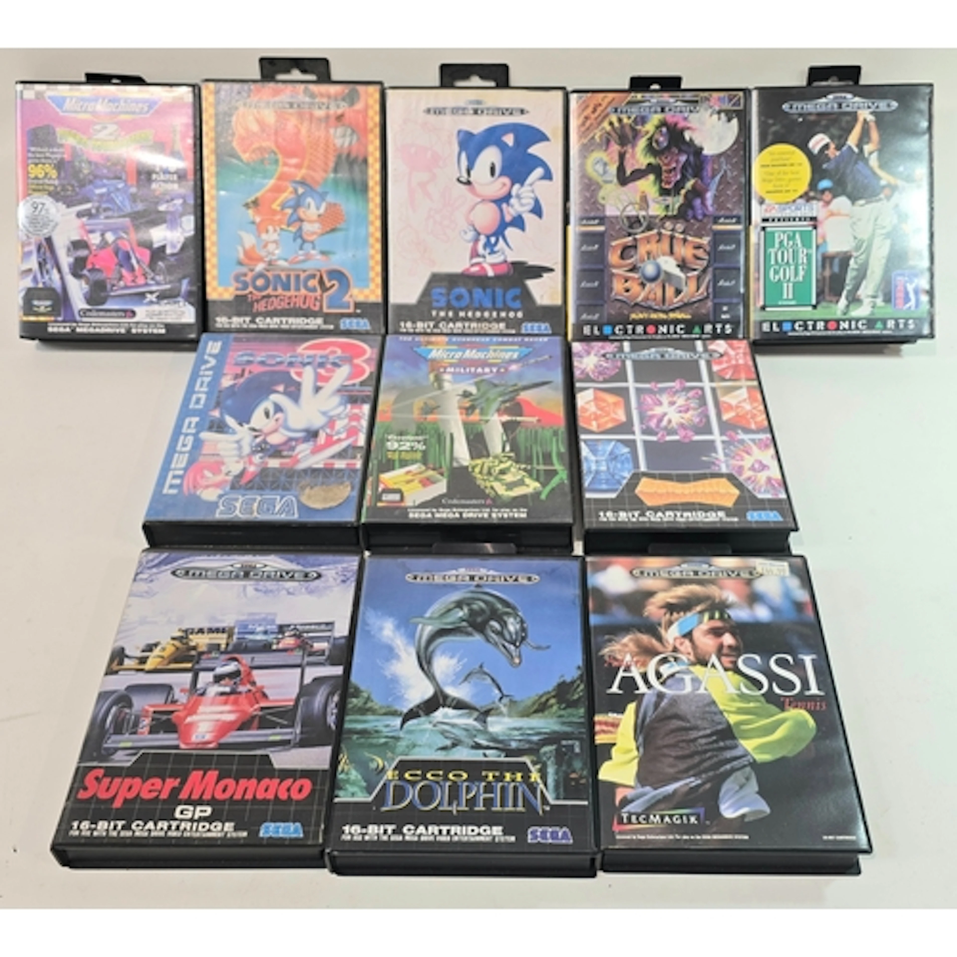 A collection of 11 boxed vintage Sega Mega Drive games to in...