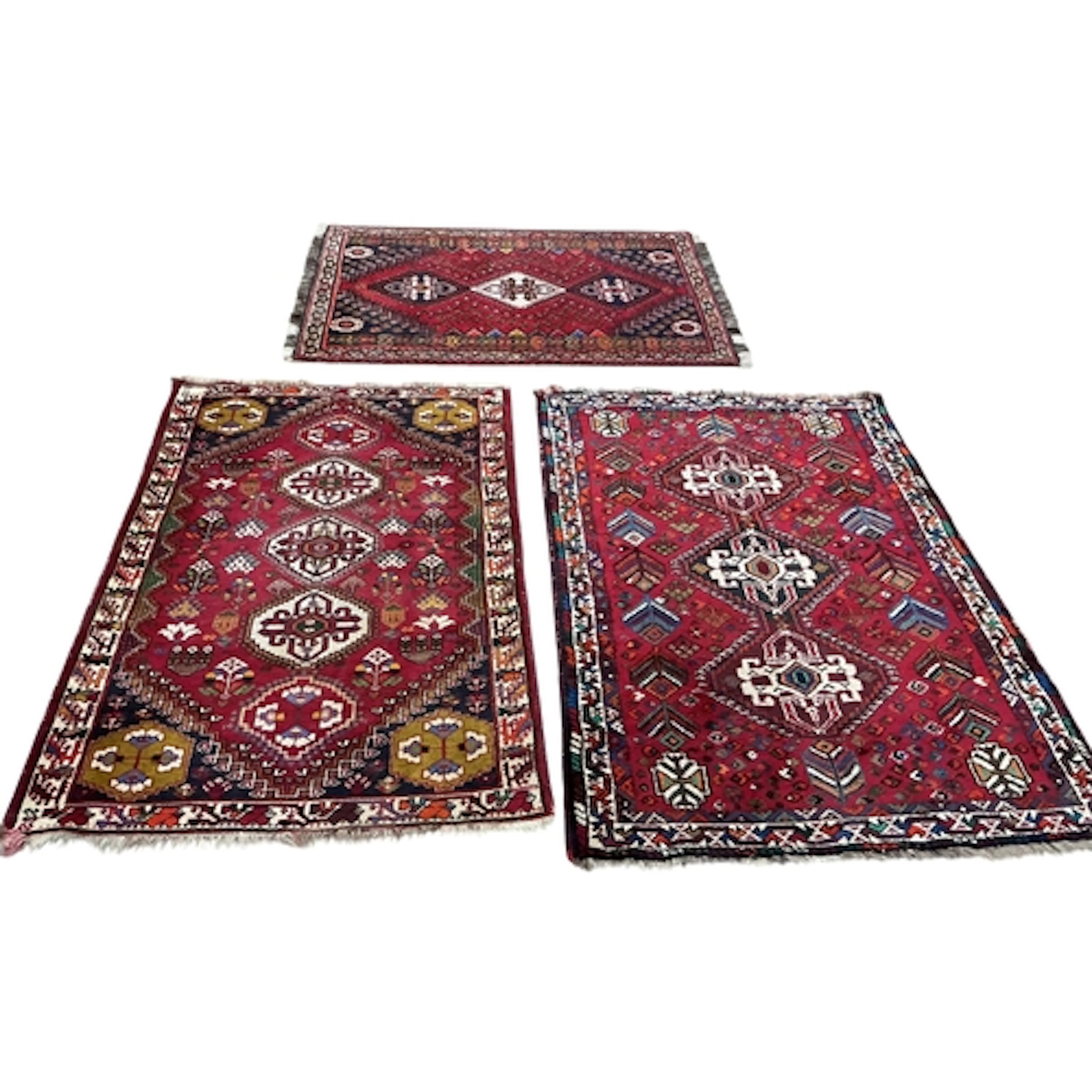 Three modern Persian Shiraz rugs, 160 x 106cm, 166 x 118cm a...