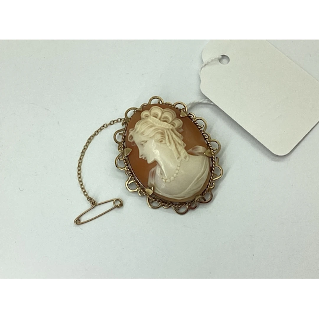 A 9ct Gold Oval Shell Carved Cameo Brooch, depicting female ...