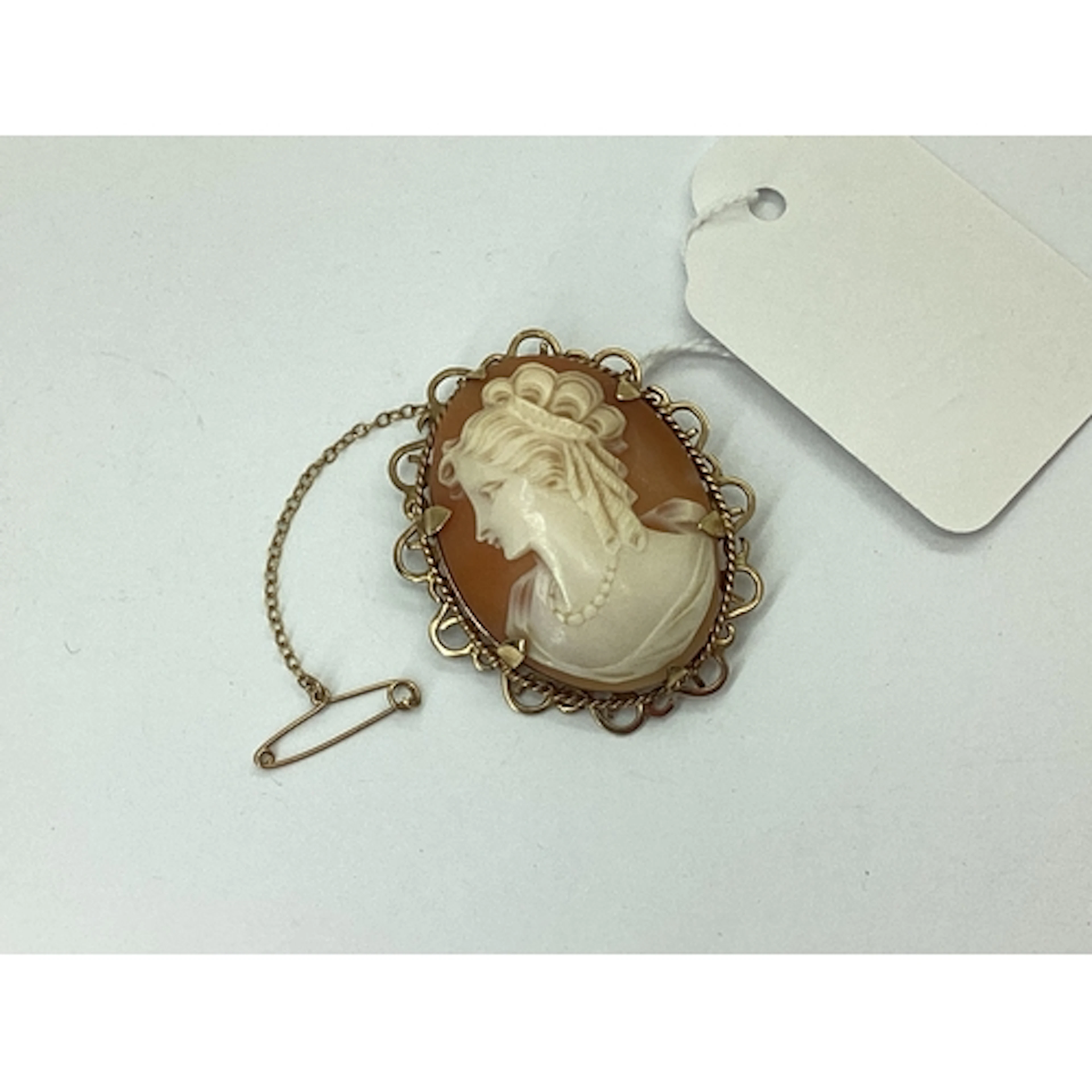 A 9ct Gold Oval Shell Carved Cameo Brooch, depicting female ...