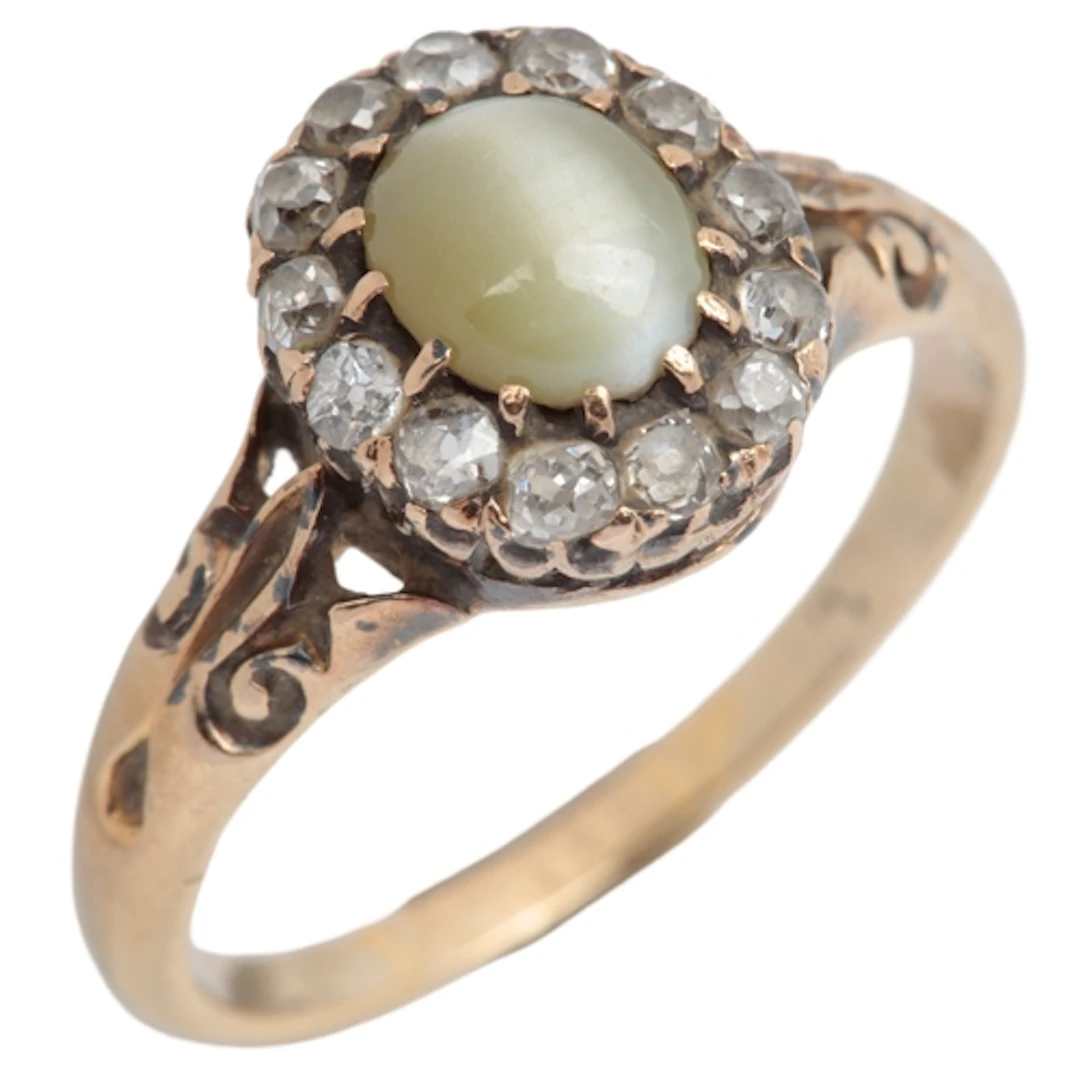 A cat's eye chrysoberyl and diamond cluster ring, late 19th ...