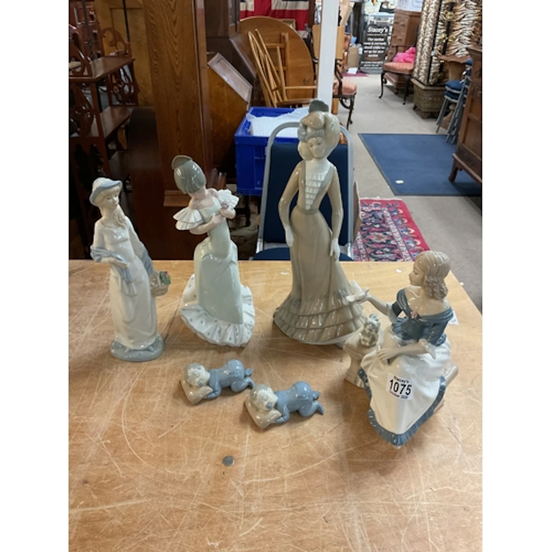 NAO Spanish girl, three Spanish ceramics and two sleeping ba...
