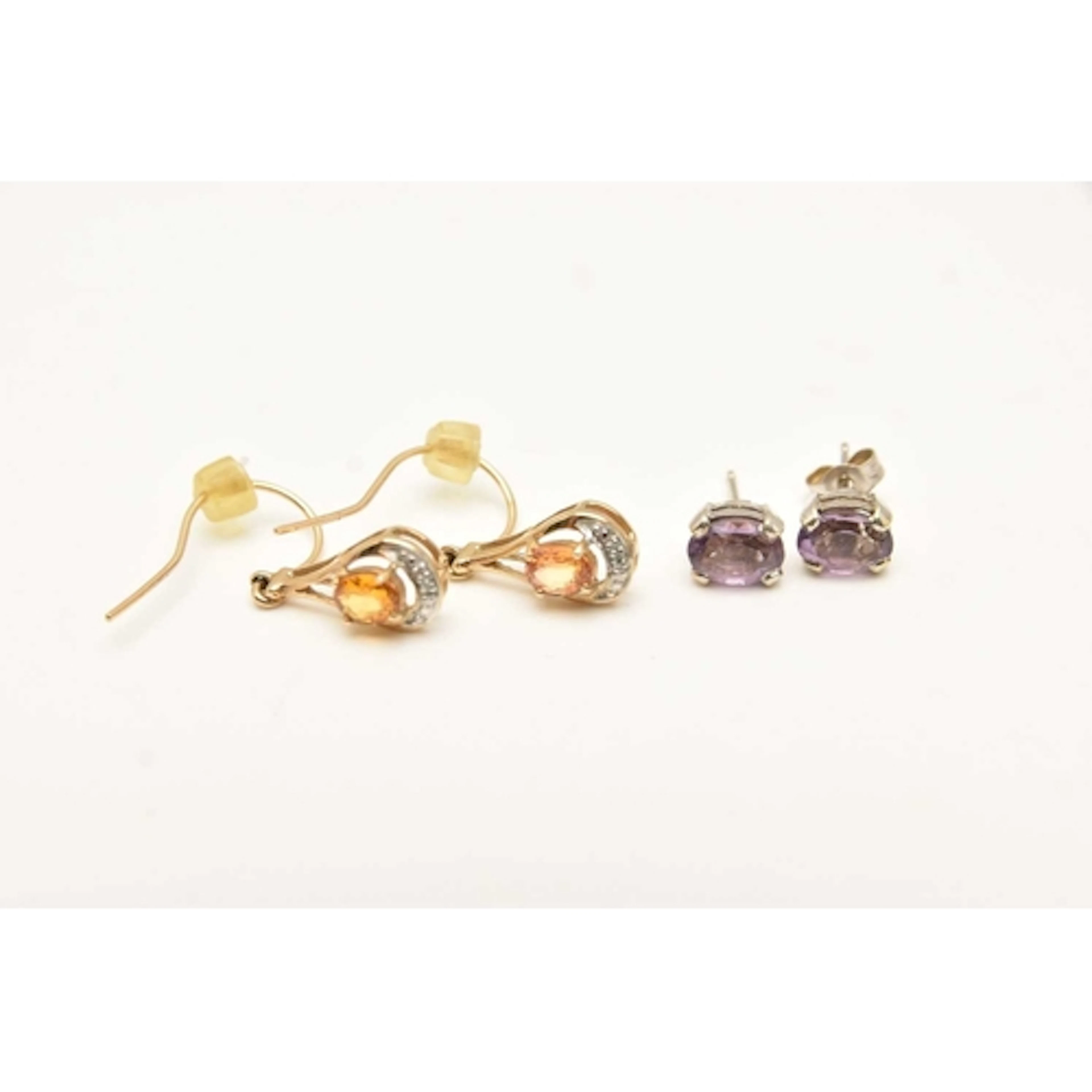 TWO PAIRS OF GEM SET EARRINGS, the first a pair of yellow me...