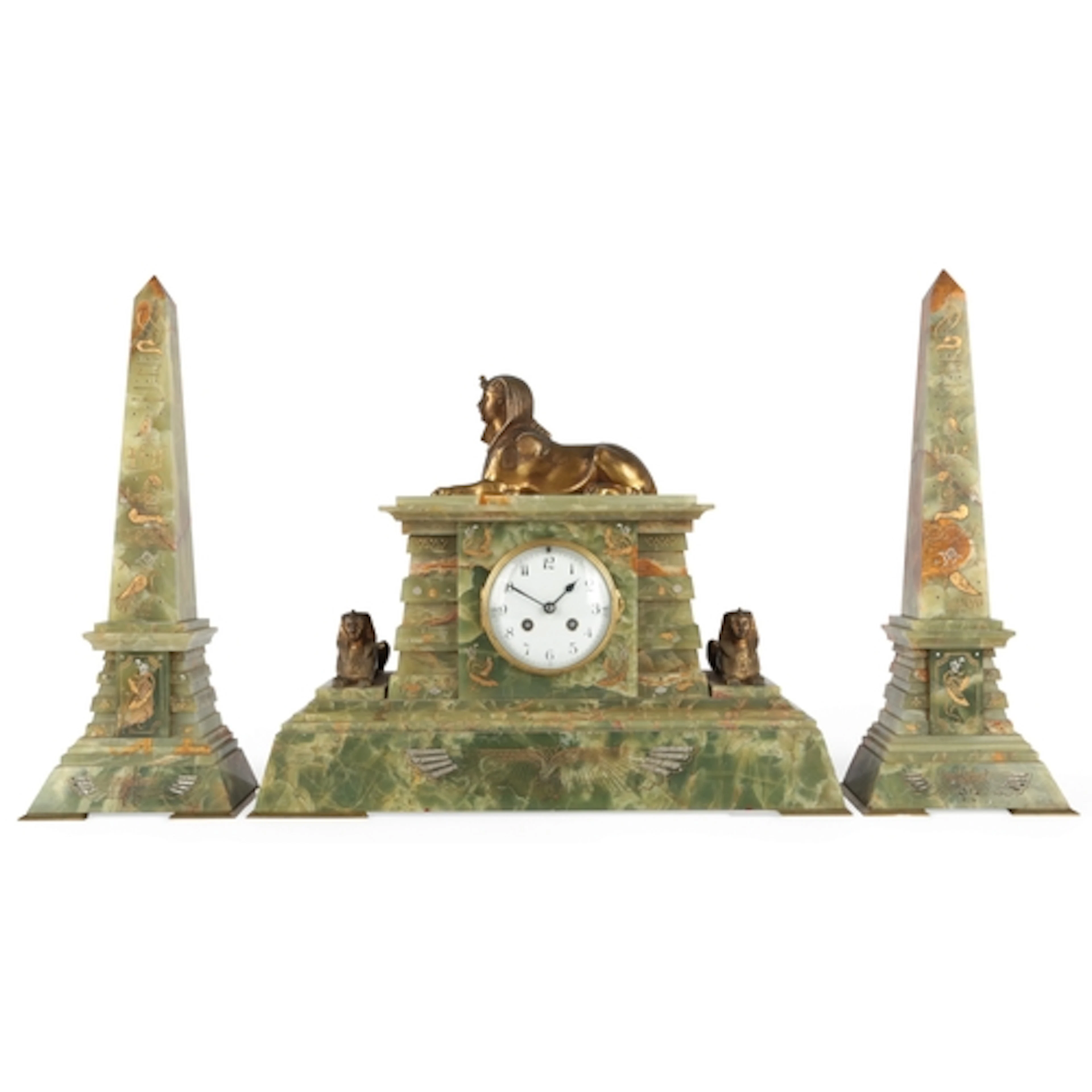 A French gilt bronze and onyx Egyptian revival clock garnitu...
