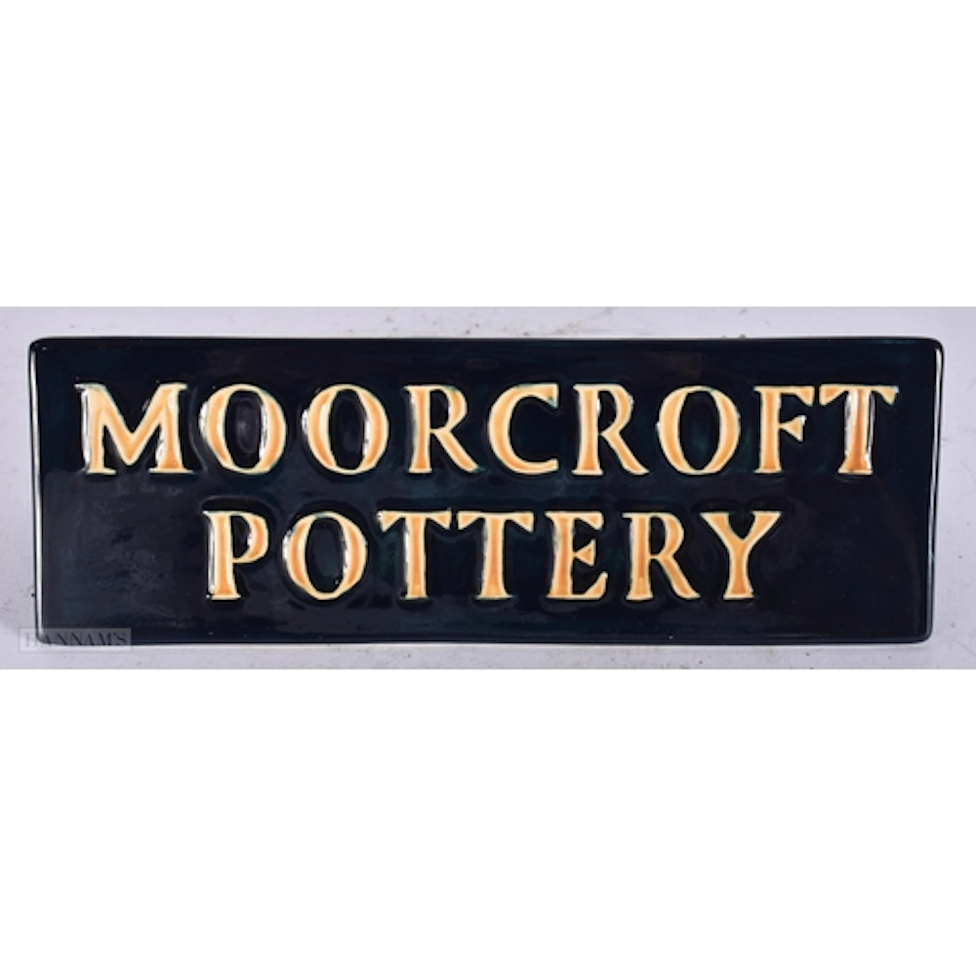 A BOXED MOORCROFT POTTERY PLAQUE. 16 cm wide.