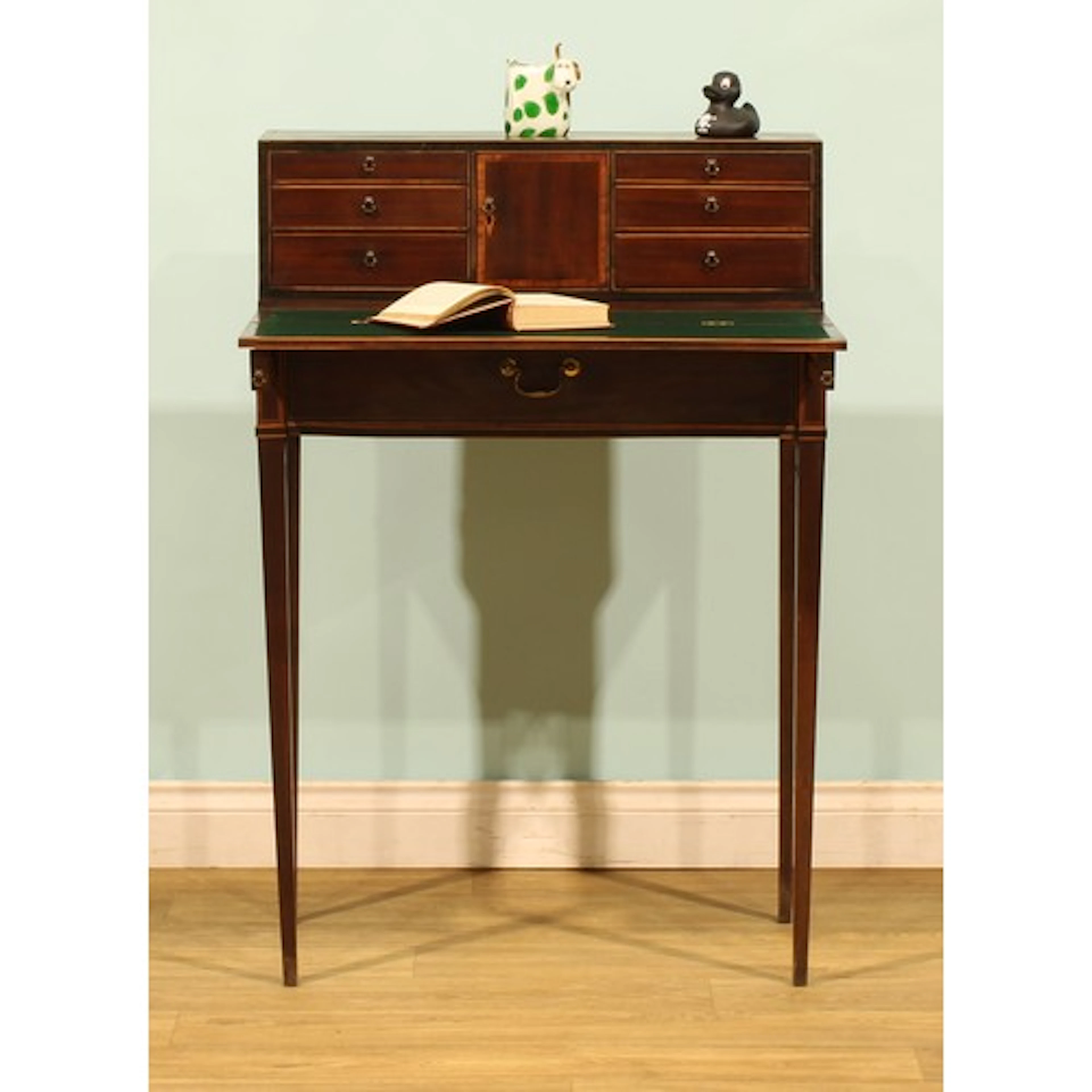 A George III mahogany bonheur du jour, the superstructure wi...