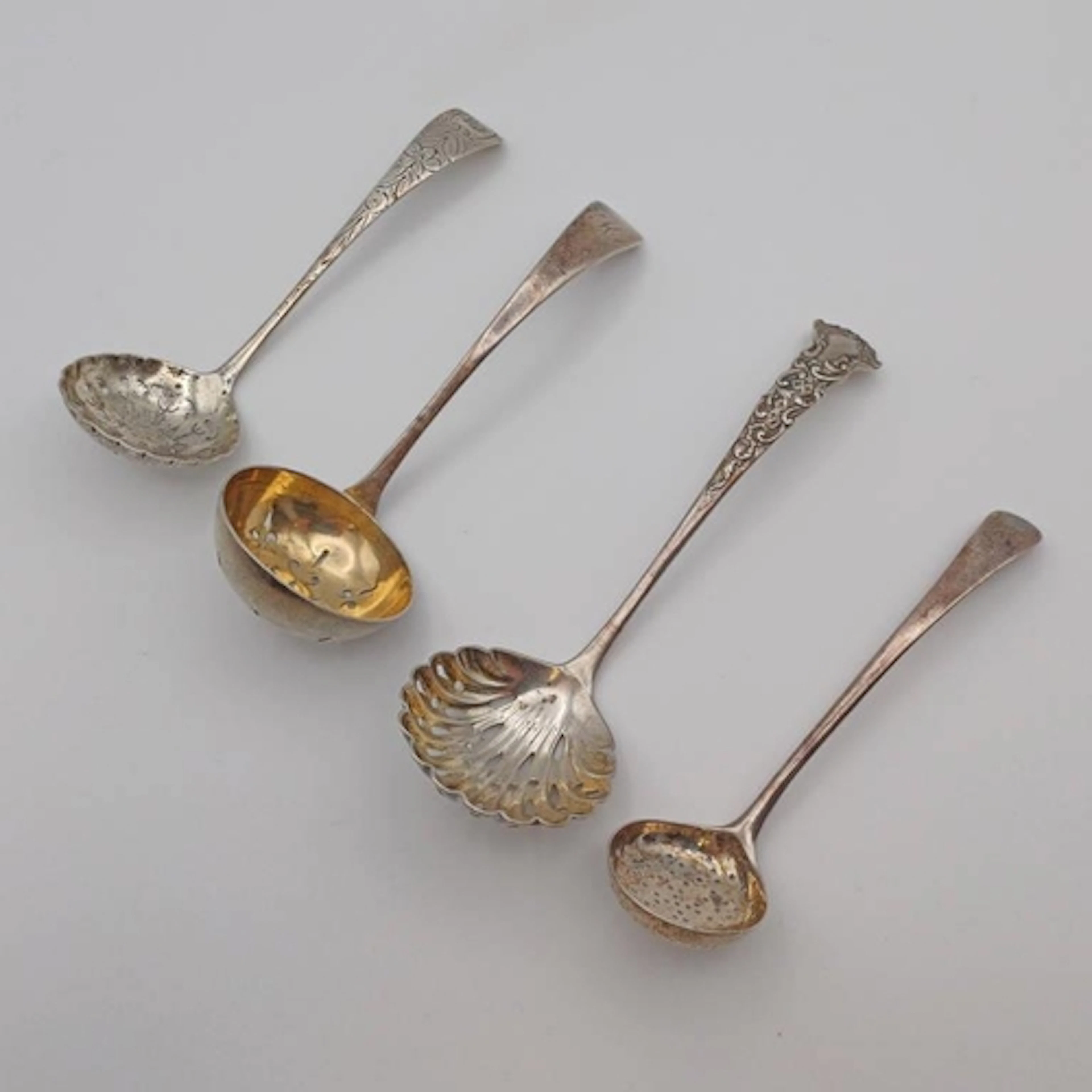 4 SILVER SUGAR SIFTER LADLES TO INCLUDE A GEORGE III EXAMPLE...