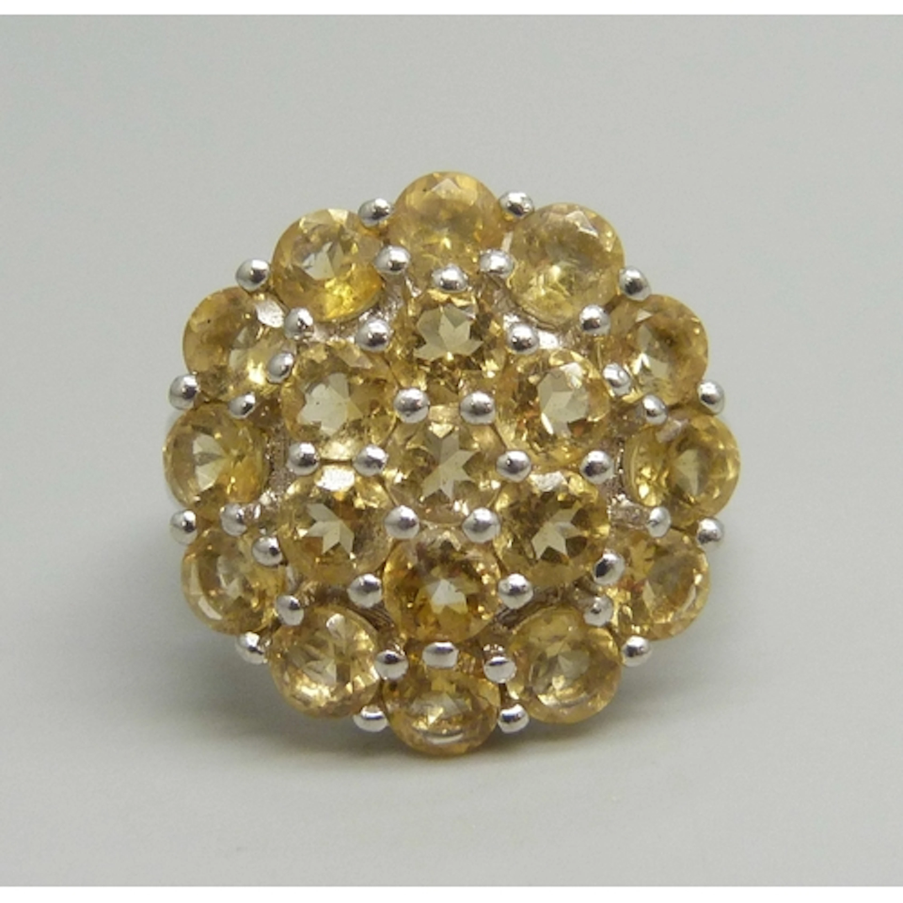A TGGC statement silver and citrine cluster ring, N/O