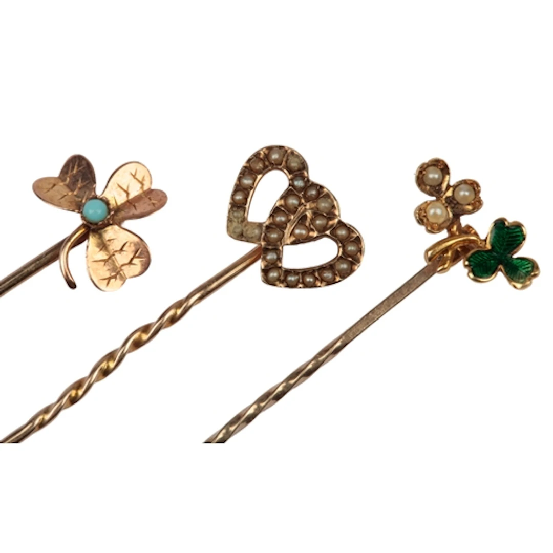 Three stick pins, early 20th century, comprising: a stick pi...